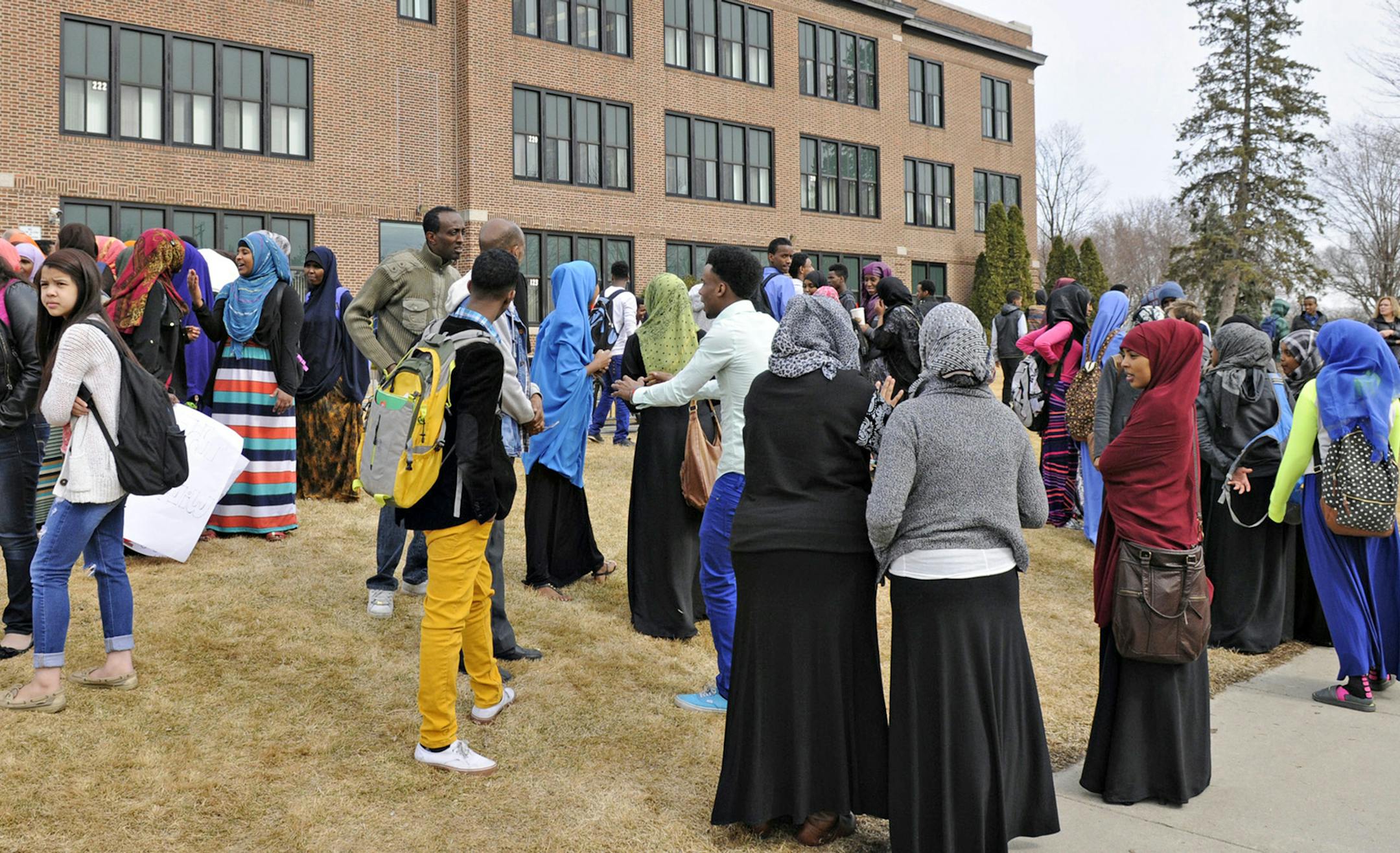 A group of students walked out of classes in protest of recent racial slurs on social media at St. Cloud Technical High School Wednesday, March 15, 2015. (AP Photo/The St. Cloud Times, Jason Wachter) ORG XMIT: MNCLO102