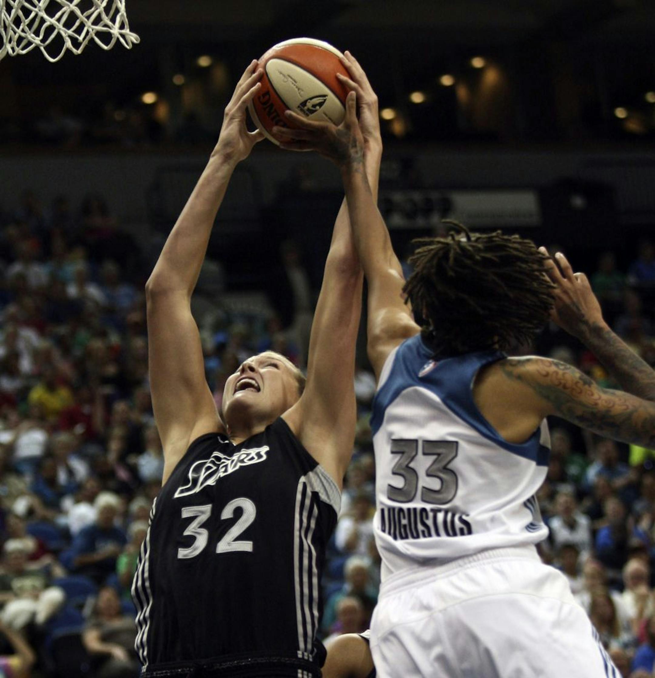 Seimone Augustus battled for the ball with San Antonio's Jayne Appel in the first half at Target Center. The Lynx edged the Silver Stars 62-60.