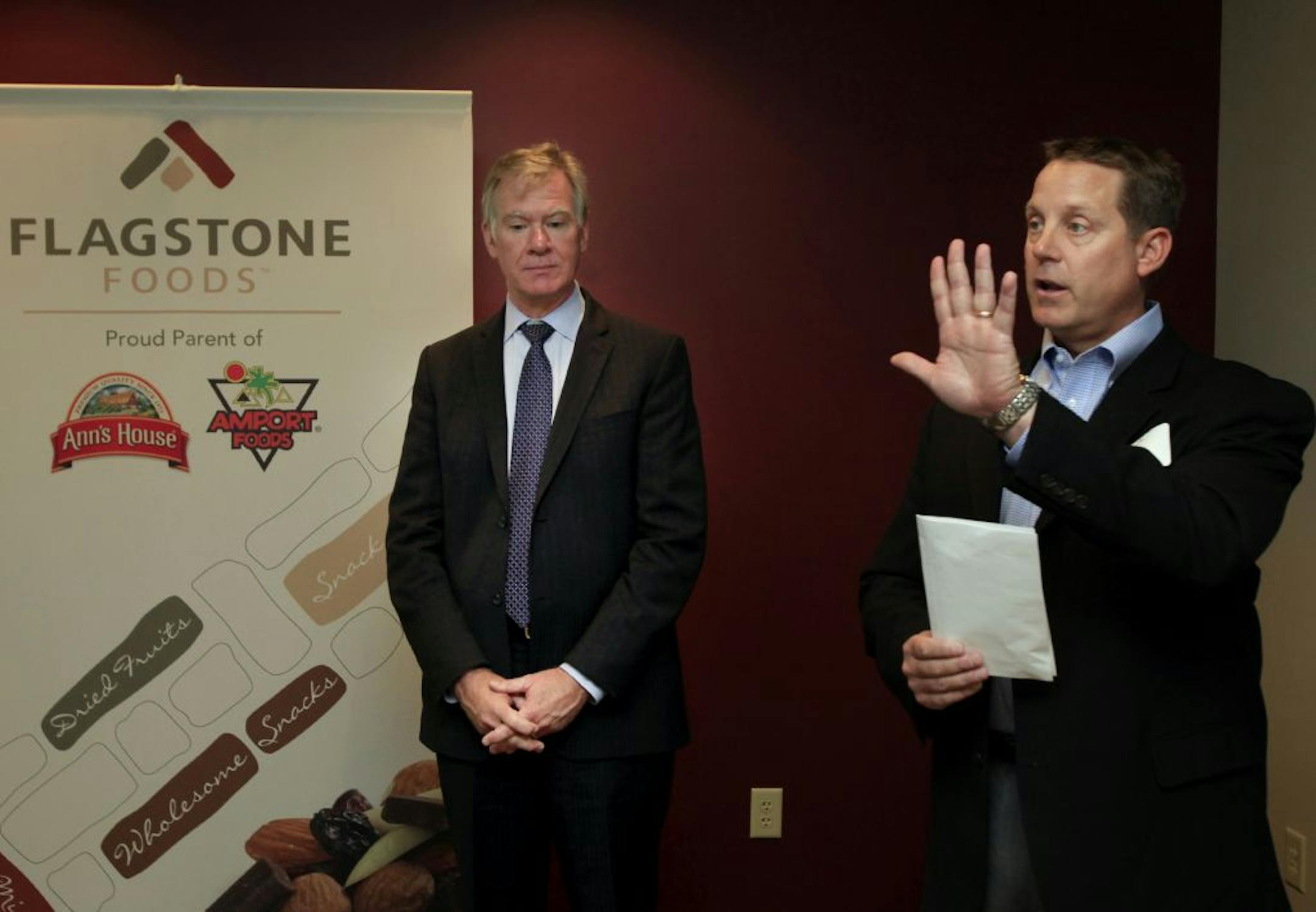 CEO Paul Lapadat ( right ) of Flagstone Foods said a few words before cutting the ribbon with St. Paul Mayor Chris Coleman ( right ) at the the new HQ in St. Paul, MN on September 27, 2012.