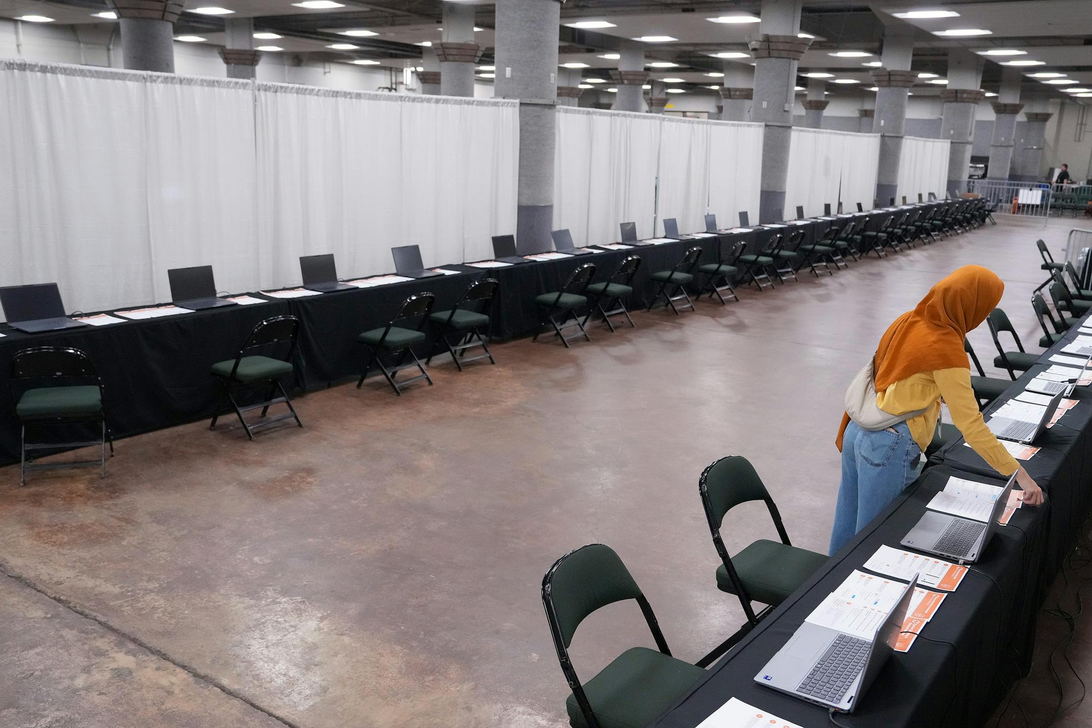 Teams from various departments works to set the Operation Secure St. Paul global password reset headquarters during a media tour Saturday, Aug. 9, 2025 at the Roy Wilkins Auditorium in St. Paul, Minn.