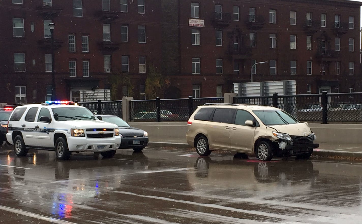 A gold Toyota Sienna with front-end damage was stopped on Park Avenue over I-94 in Minneapolis on Friday morning.