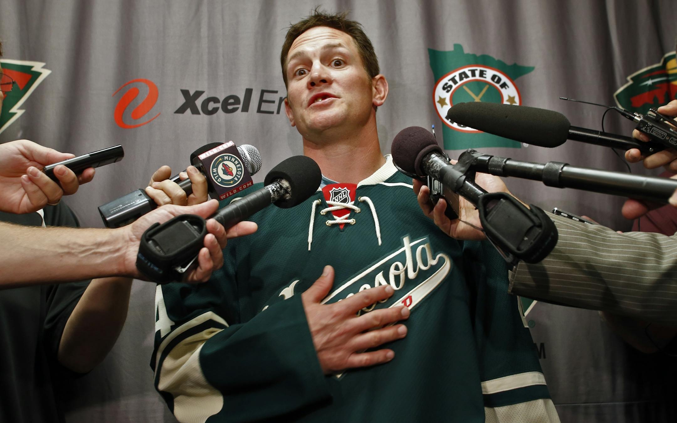 New Minnesota Wild arrival Matt Cooke met the local media Wednesday and modeled his jersey #24 that was previously worn by Derek Boogaard. (MARLIN LEVISON/STARTRIBUNE(mlevison@startribune.com