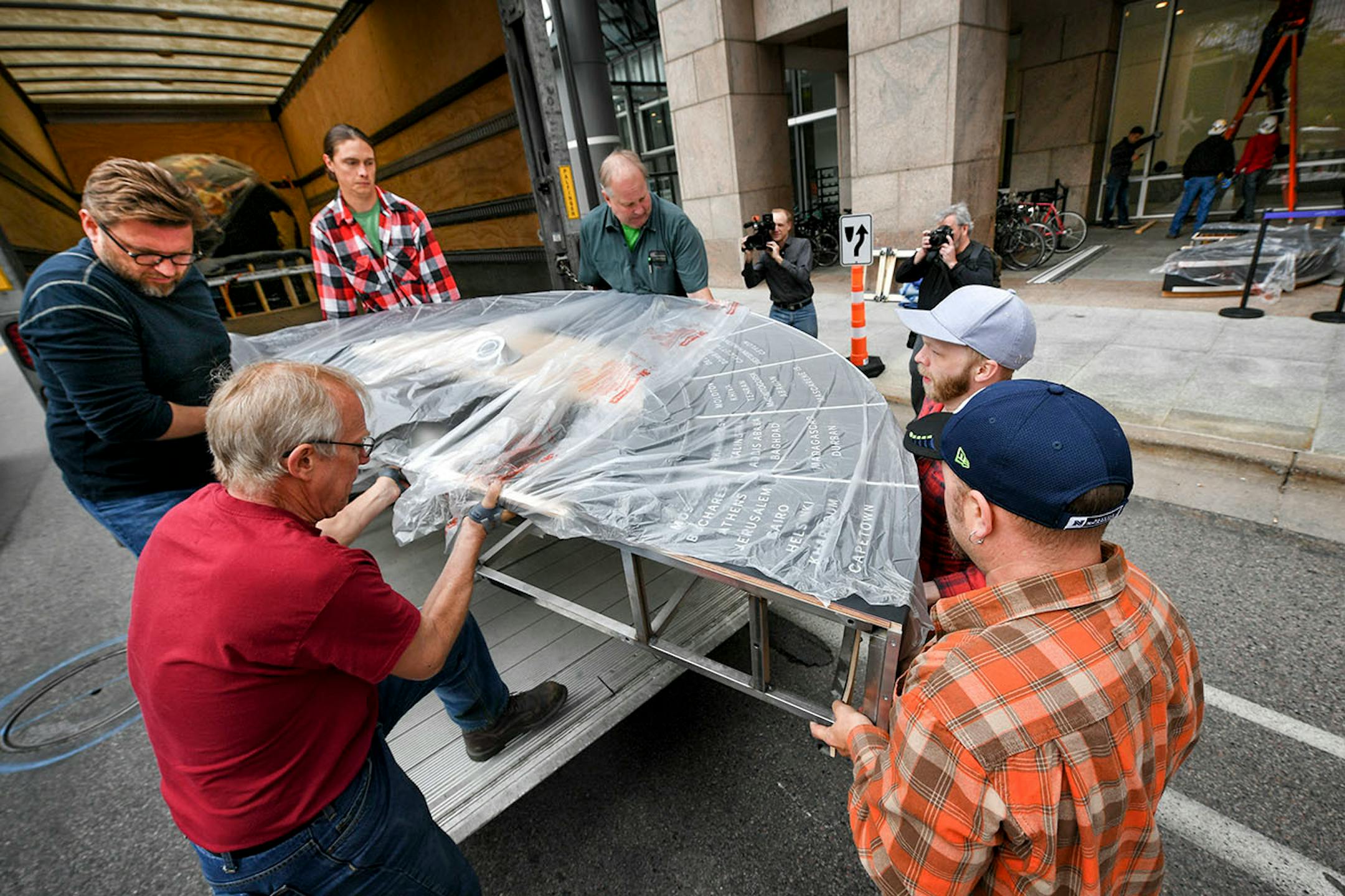 Workers from Blue Rhino Studio in Eagan handled the restoration and placement of the Star Tribune globe.