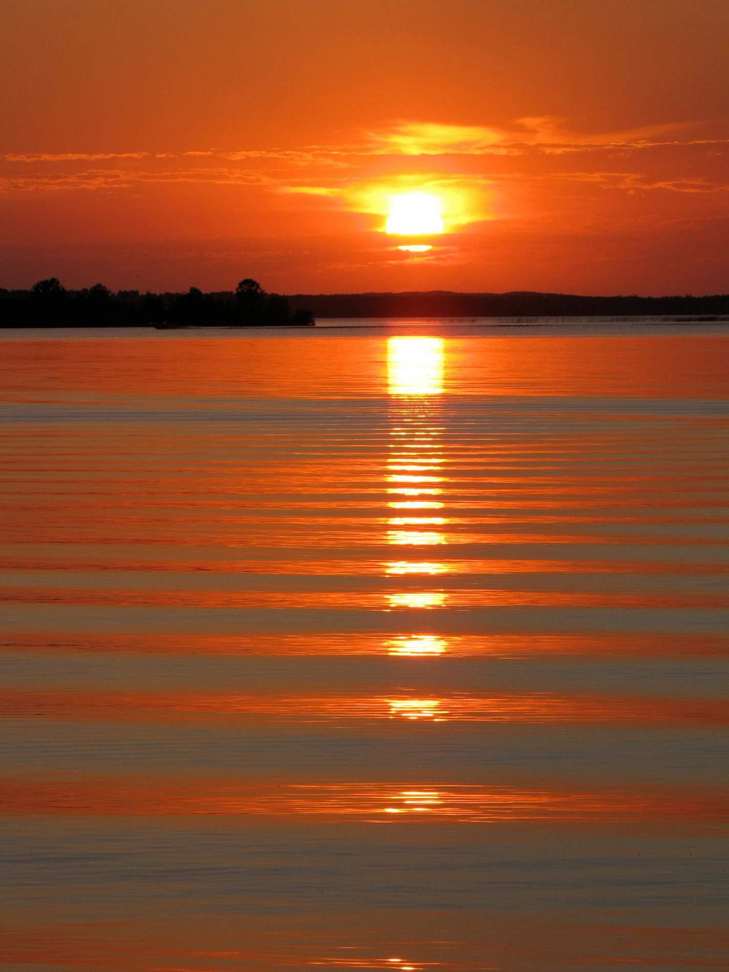 Cass Lake Camping: Campers at Norway Beach Recreation Area can enjoy sunsets across Cass Lake in the Chippewa National Forest. Photo by Lisa Meyers McClintick