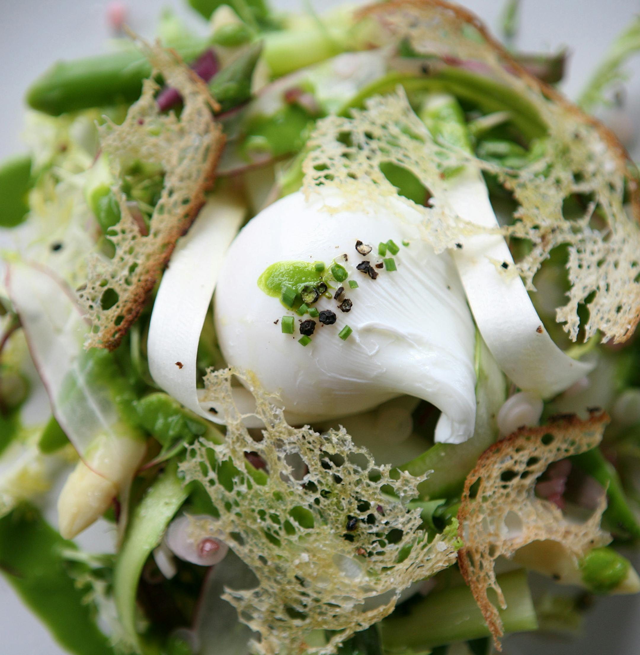 Asparagus salad with poached egg, pickled ramp, ramp vinaigrette, crouton, and sarvecchio at Corner Table in Minneapolis June 7, 2013. (Courtney Perry/Special to the Star Tribune)