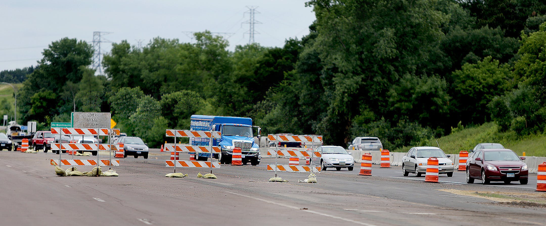Traffic made its way through ongoing road construction along Highway 36, Tuesday, July 30, w013 in Oakdale, MN. Potential designs for Hwy. 36 interchanges in Oakdale would eliminate stoplights, creating a faster commuter corridor through that city. That work would come after work is completed at Hilton Trail interchange in Pine Springs and farther to the west, at the rebuilding of English Street interchange in Maplewood. In both cases stoplights were eliminated. Once Hwy. 36 is refashioned throu