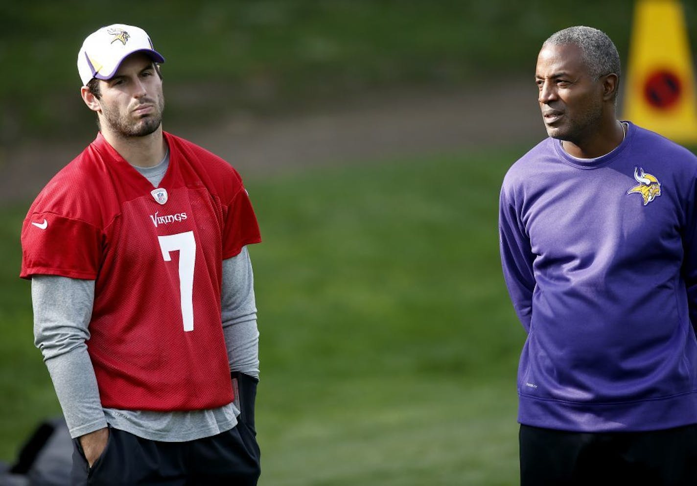 Minnesota Vikings quarterback Christian Ponder (7) stood by quarterbacks coach Craig Johnson during practice. Ponder did not participate in Friday's practice at The Grove in Watford, England.