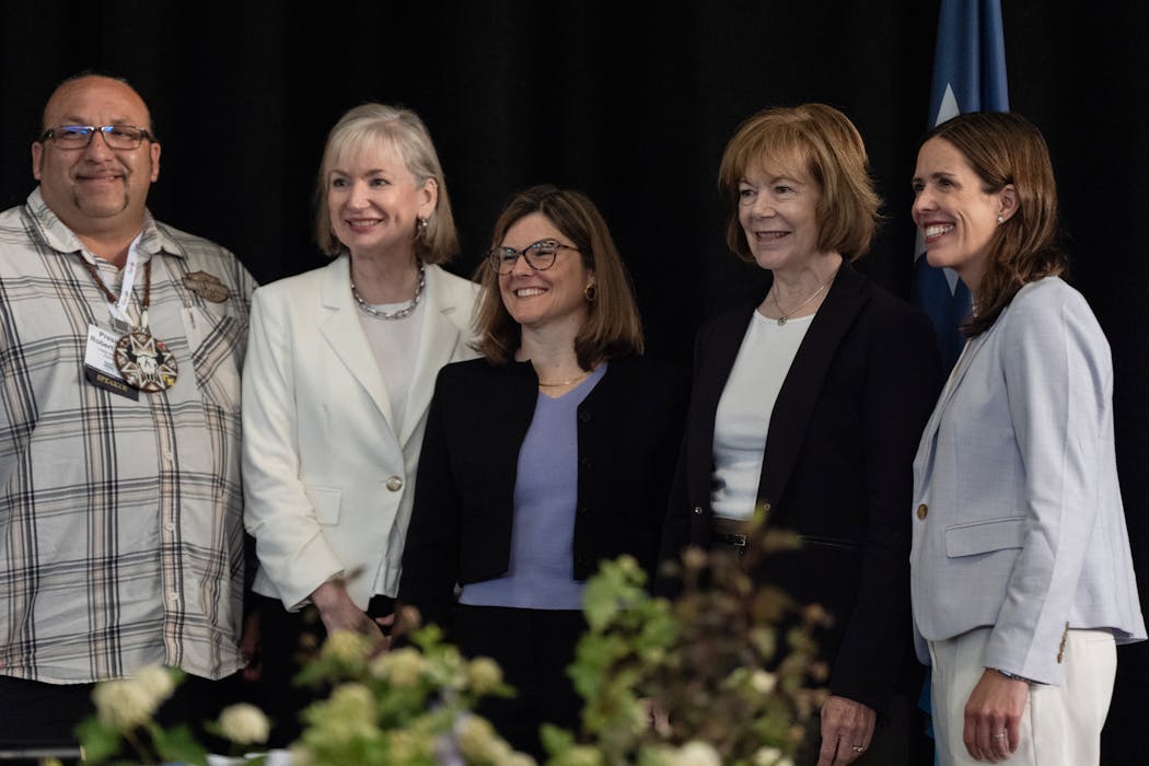 Robert Larsen, president of the Lower Sioux Indian Community; Bethany Owen, CEO of Allete Inc.; FERC Commissioner Allison Clements; U.S. Sen. Tina Smith; and Minnesota Public Utilities Commission Chair Katie Sieben pose for a picture after a panel discussion at the conference.