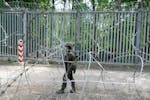 FILE - A Polish soldier patrols the border with Belarus, in Bialowieza Forest, on May 29, 2024, the day after a young soldier, Mateusz Sitek, was stab