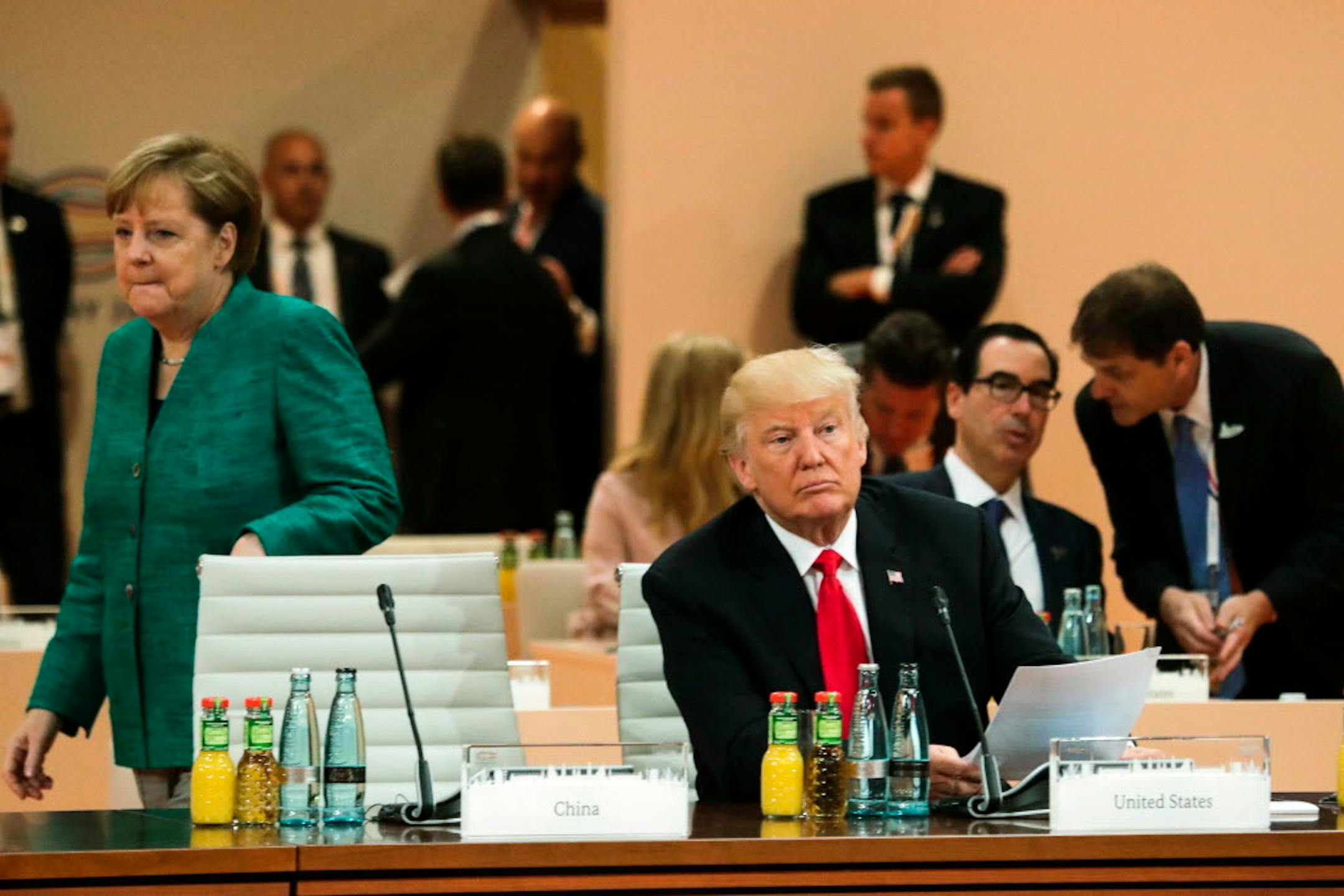 German Chancellor Angela Merkel, pictured Saturday with President Donald Trump, called the U.S. position on climate change "regrettable" She said the U.S. position was "regrettable" but said that the summit had achieved "good results in some areas."