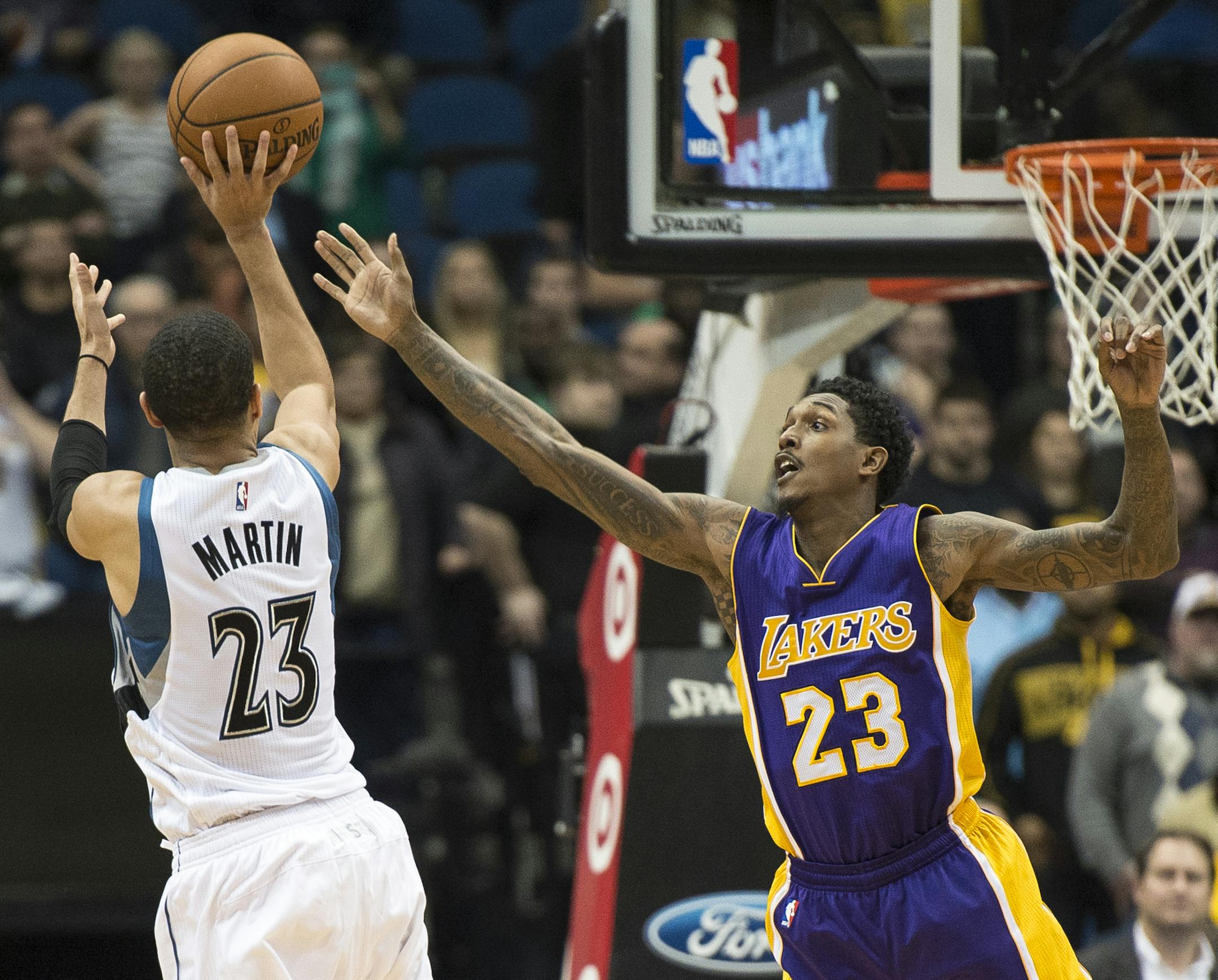 Los Angeles Lakers guard Louis Williams (23) was unable to guard against a 3-point shot by Minnesota Timberwolves guard Kevin Martin (23) in the fourth quarter Wednesday night.