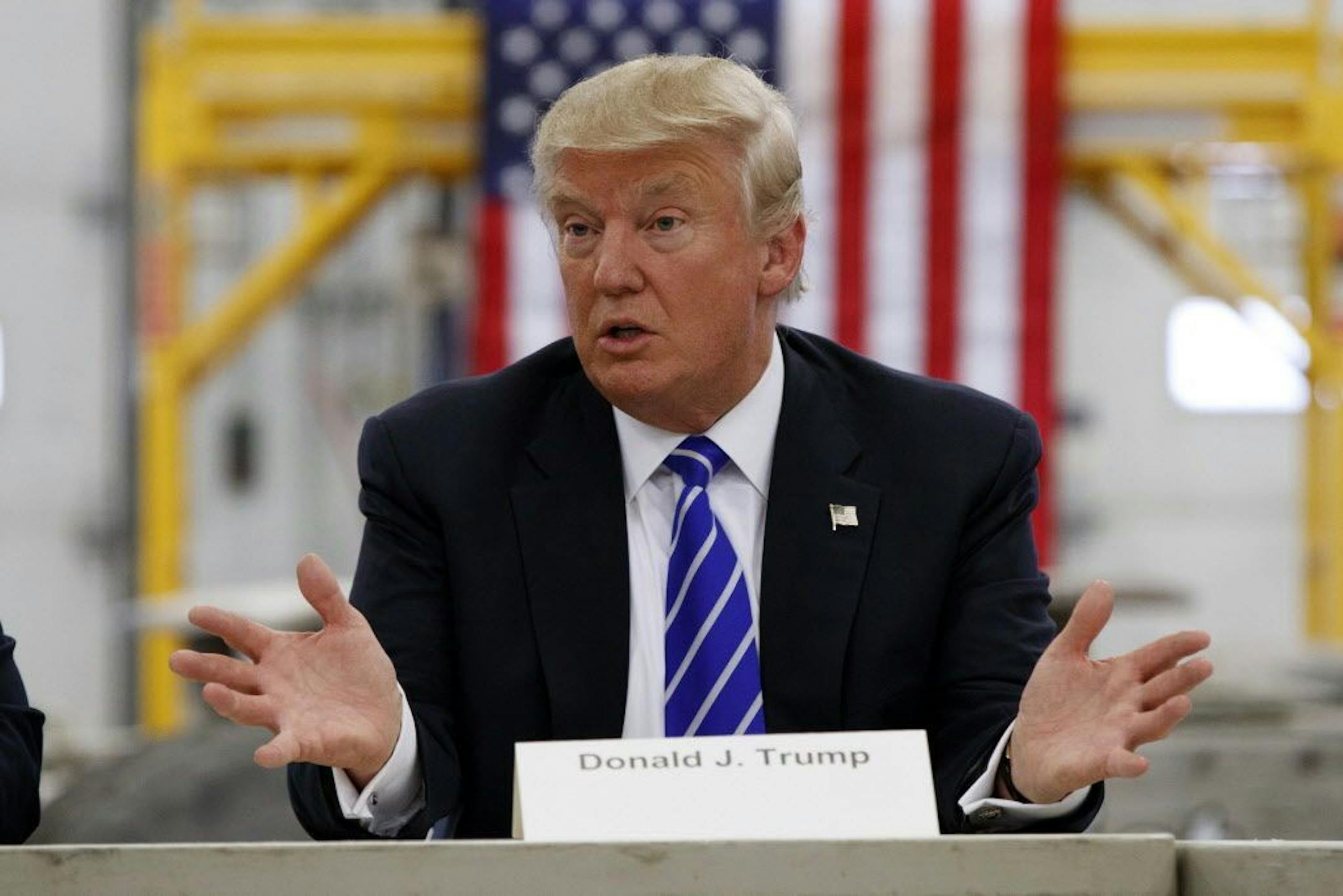 In this Aug. 10, 2016, photo, Republican presidential candidate Donald Trump speaks during a coal mining roundtable at Fitzgerald Peterbilt in Glade Spring, Va.