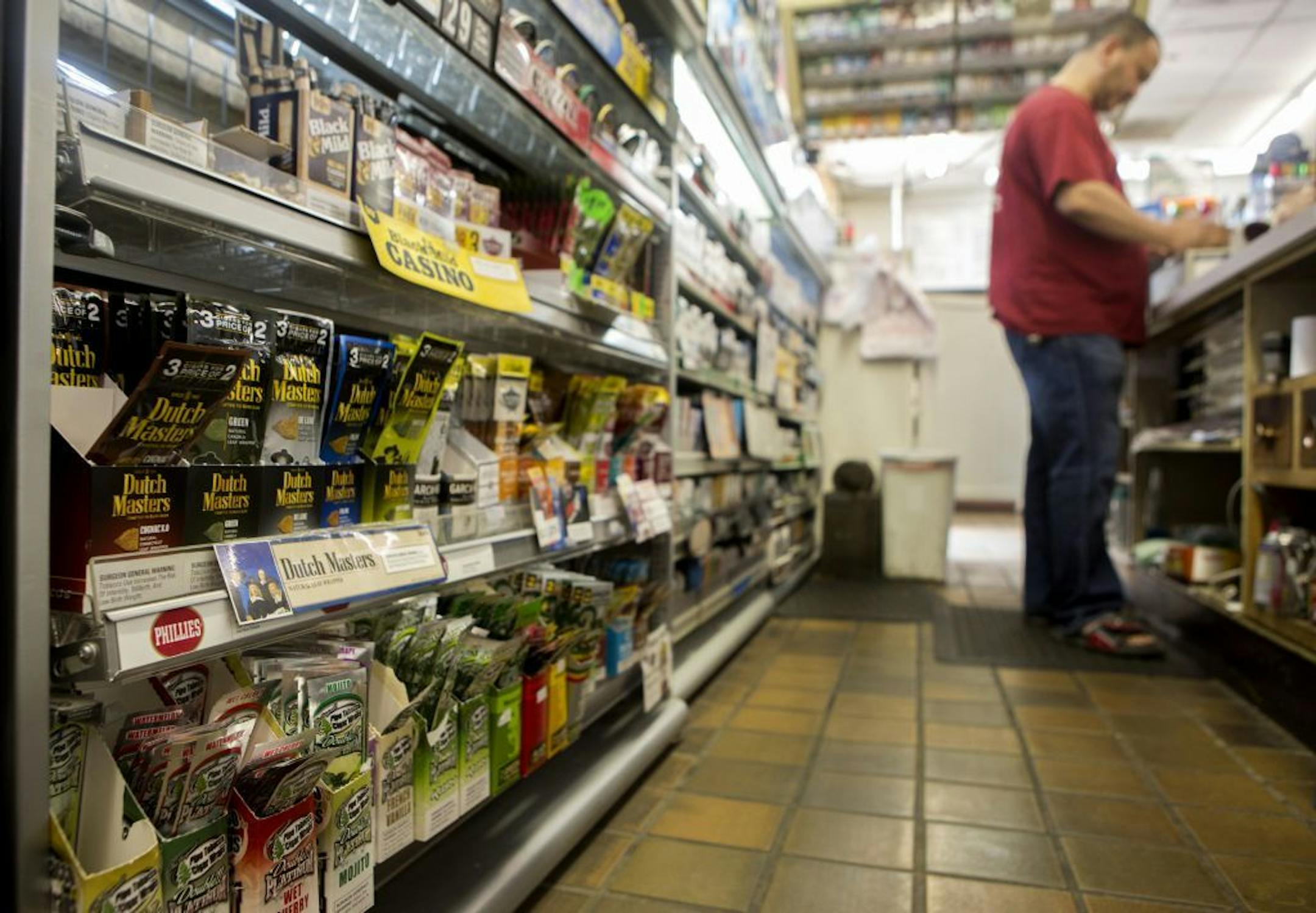Flavored cigars are for sale at Loon Grocery and Deli in Minneapolis, Minn., Monday, June 8, 2015. The Minneapolis City Council began discussing a proposal today to restrict the sale of flavored cigars to tobacco shops and sets a minimum price for cigars sold in all stores. The move is aimed at reducing youth tobacco use.