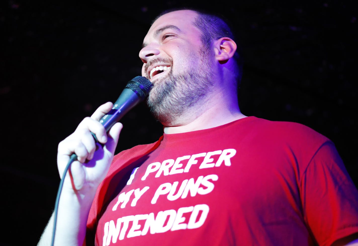 From top left, clockwise: competitor Christine Hottinger of Minneapolis, competitor Kyle DeGoey of St. Paul and host Art Allen in Pundamonium: The Twin Cities Pun Slam.