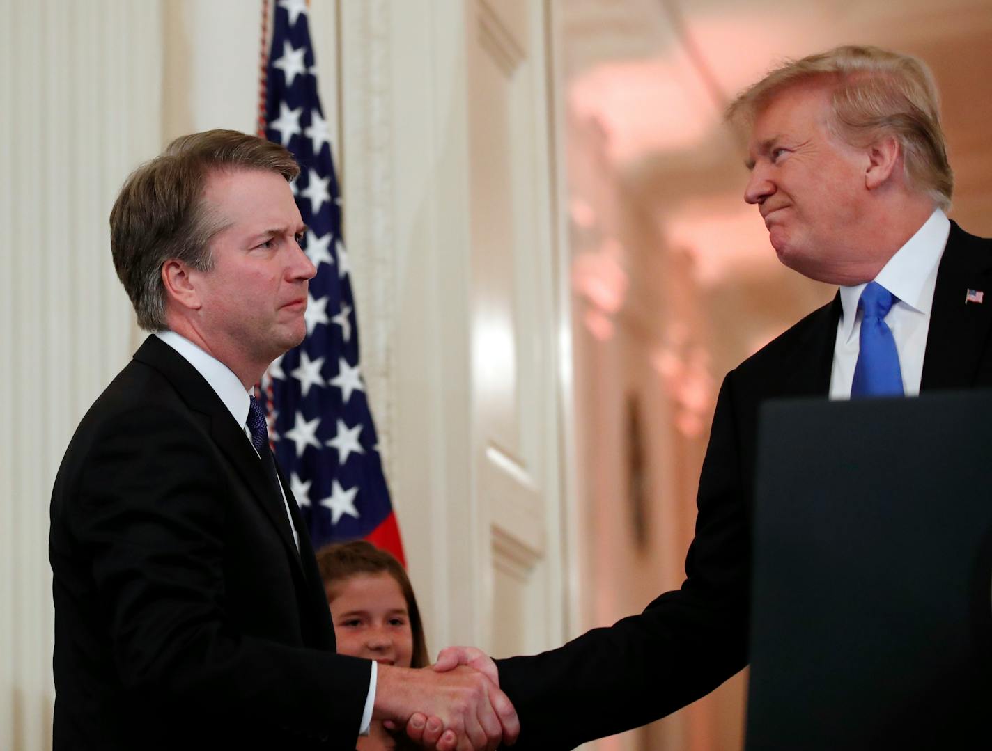 President Donald Trump shakes hands with Judge Brett Kavanaugh his Supreme Court nominee, in the East Room of the White House, Monday, July 9, 2018, in Washington.