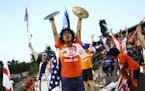 Carolina RailHawks fans, some wearing Traffic Out T-shirts, cheer during game against the New York Cosmos in Cary, N.C., Aug. 22, 2015. The RailHawks 