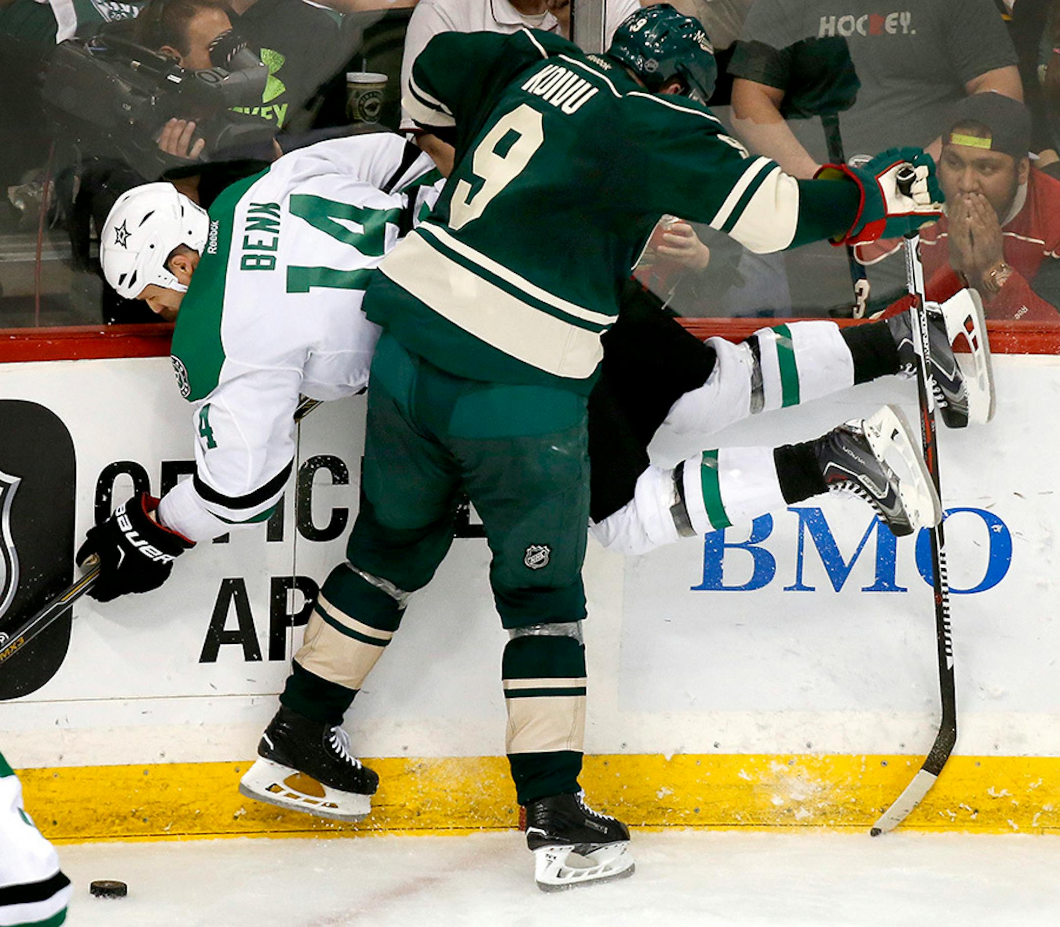 Mikko Koivu (9) collided with Jamie Benn (14) in the second period.