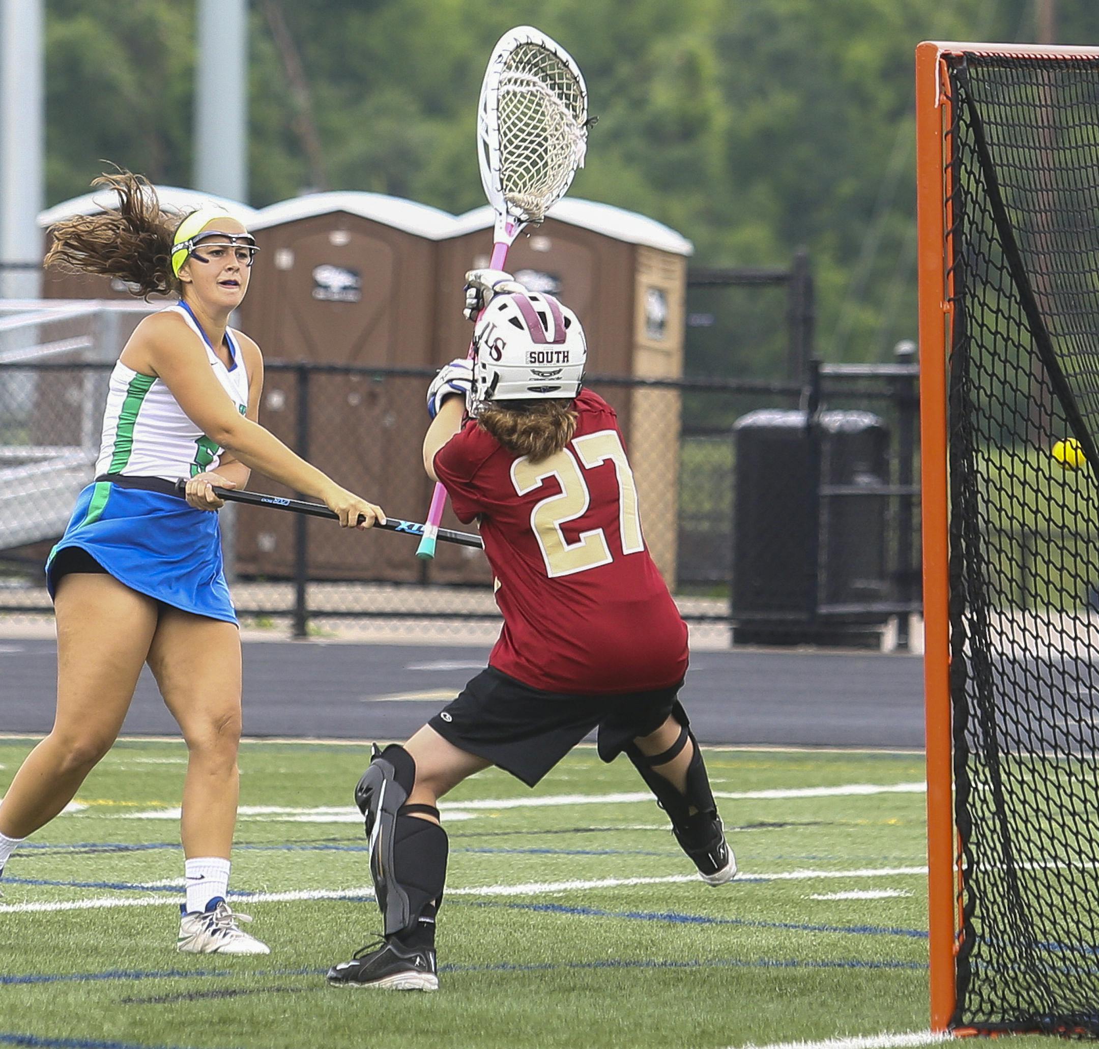 ] Timothy Nwachukwu • timothy.nwachukwu@startribune.com Despite heavy rains and an early weather delay, the Blake School (Minneapolis) Bears defeated the Lakeville South Cougars 12-10 to advance to the 2016 MSHSL girls lacrosse state tournament semifinal at Chanhassen High School on Tues., June 14, 2016. The Bears will play the Prior Lake Lakers in the semifinals on June 16.