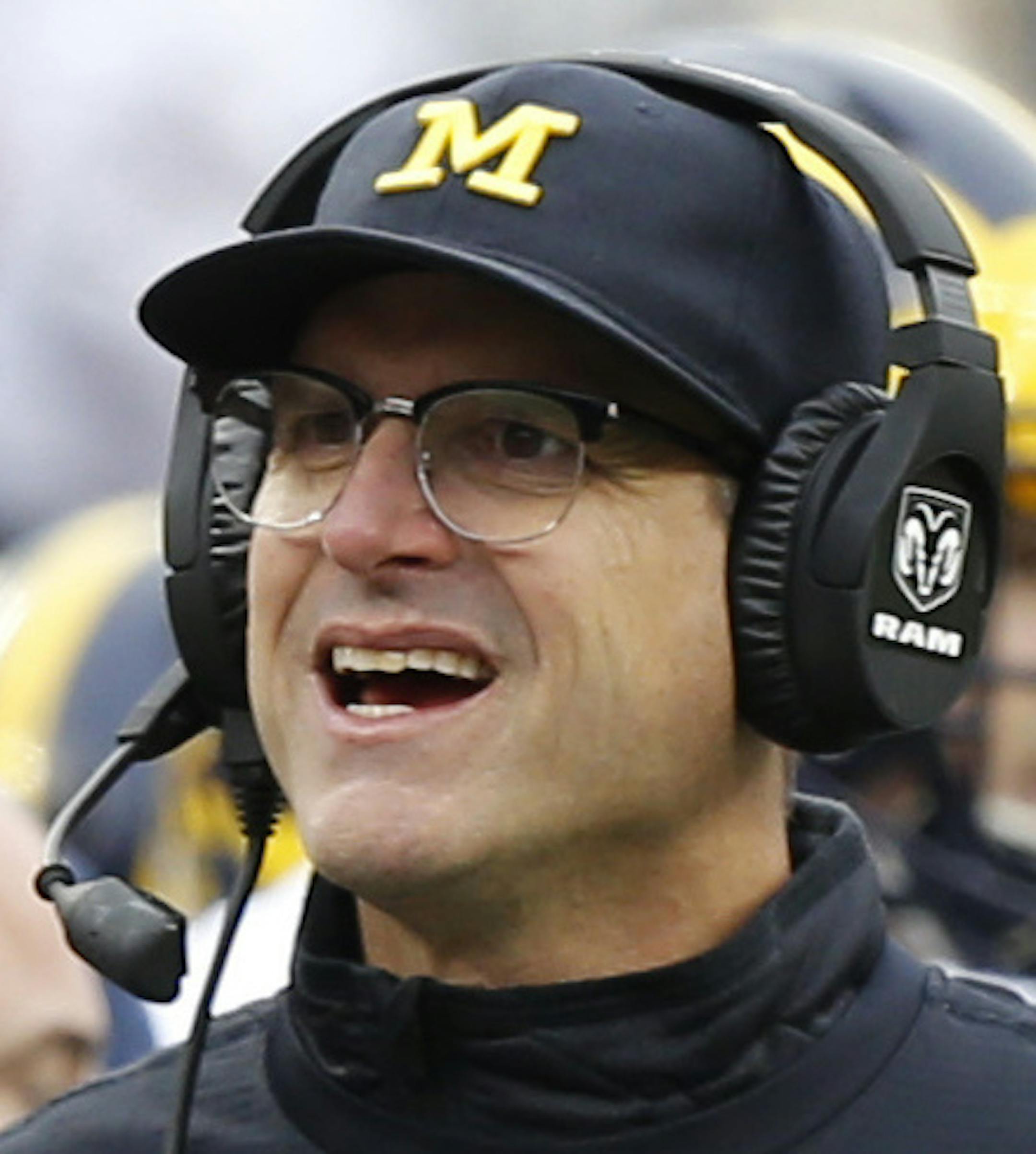 Michigan head coach Jim Harbaugh walks the sidelines during the second half of an NCAA college football game Saturday, Nov. 26, 2016, in Columbus, Ohio. Ohio State beat Michigan 30-27 in double overtime. (AP Photo/Jay LaPrete)