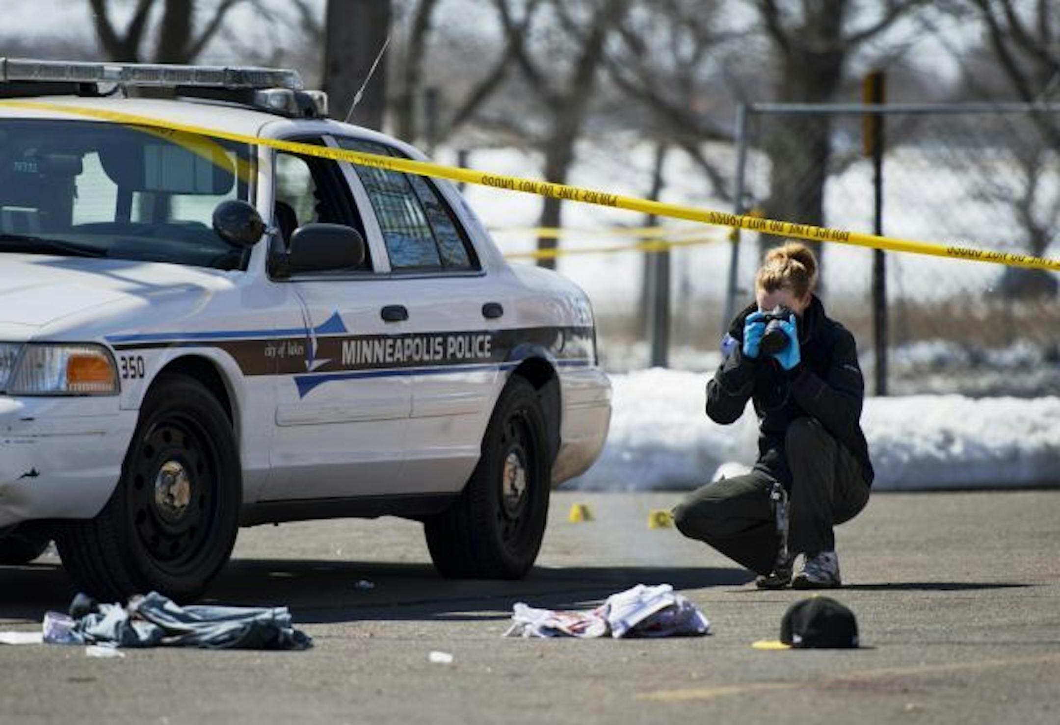 Minneapolis police investigated the scene where one person was shot in front of a convenience store just after noontime Sunday in south Minneapolis. It was believed to be non-fatal.