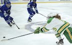 Edina's Emily Oden reached for a loose puck to tip it away from Brainerd's Olivia Wiskow in the third period. ] JEFF WHEELER &#xef; jeff.wheeler@start