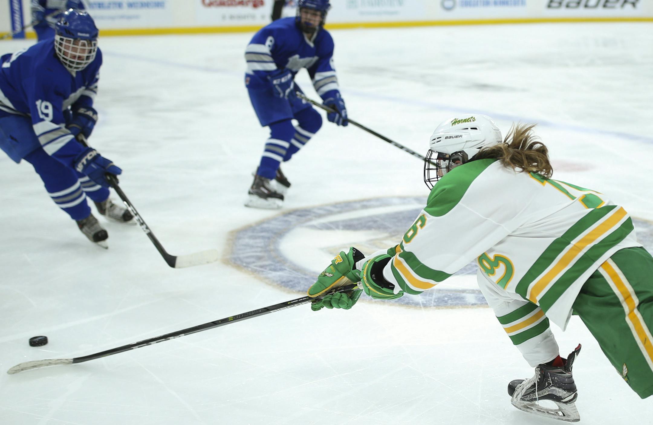 Edina's Emily Oden reached for a loose puck to tip it away from Brainerd's Olivia Wiskow in the third period. ] JEFF WHEELER ï jeff.wheeler@startribune.com Edina shut out Brainerd 4-0 in a Class 2A quarterfinal game in the Girls' Hockey Tournament Thursday night, February 22, 2018 at Xcel Energy Center in St. Paul.