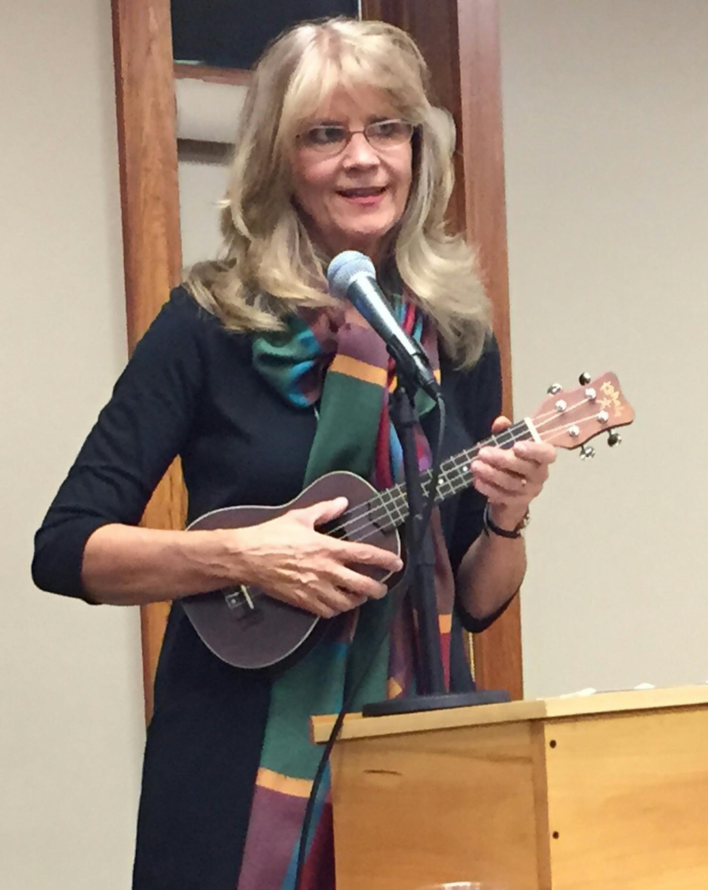 Novelist Lorna Landvik plays "You Are My Sunshine" on the ukele during her keynote talk at the North Shore Readers and Writers Festival in Grand Marais in early November 2015.