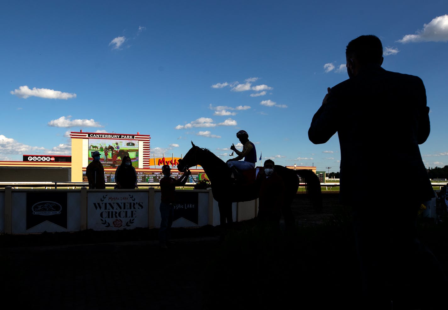 Fender Bender (1) and jockey Leslie Mawing posed for a photo in the winner's circle after the fourth race on Canterbury Park's Opening Night in June.