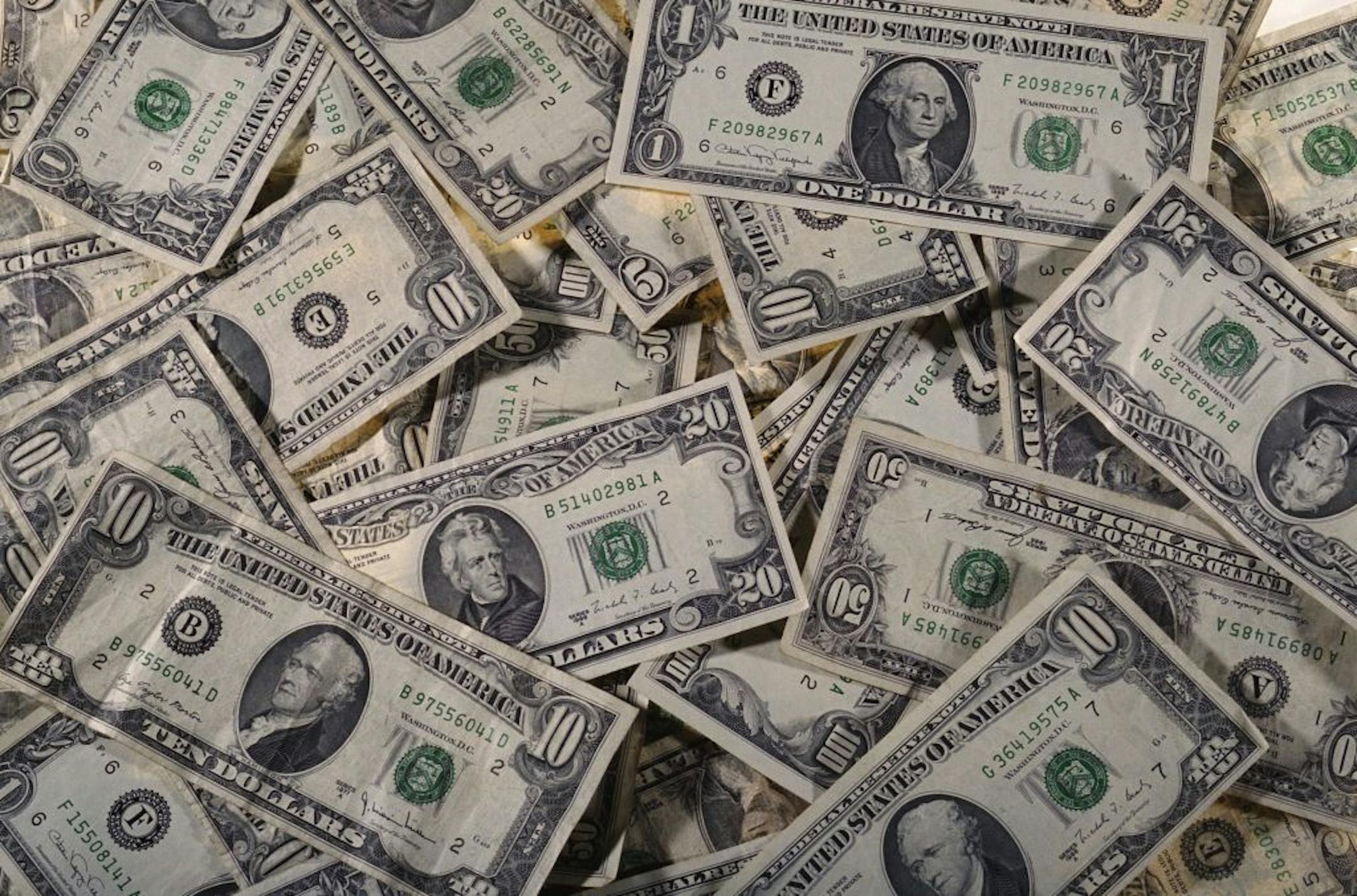 Photodisc money and dollar bills photo