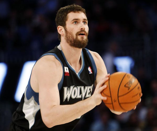 Minnesota Timberwolves' Kevin Love shoots during the NBA All-Star Three-Point Shootout basketball competition in Orlando, Fla., Saturday, Feb. 25, 201