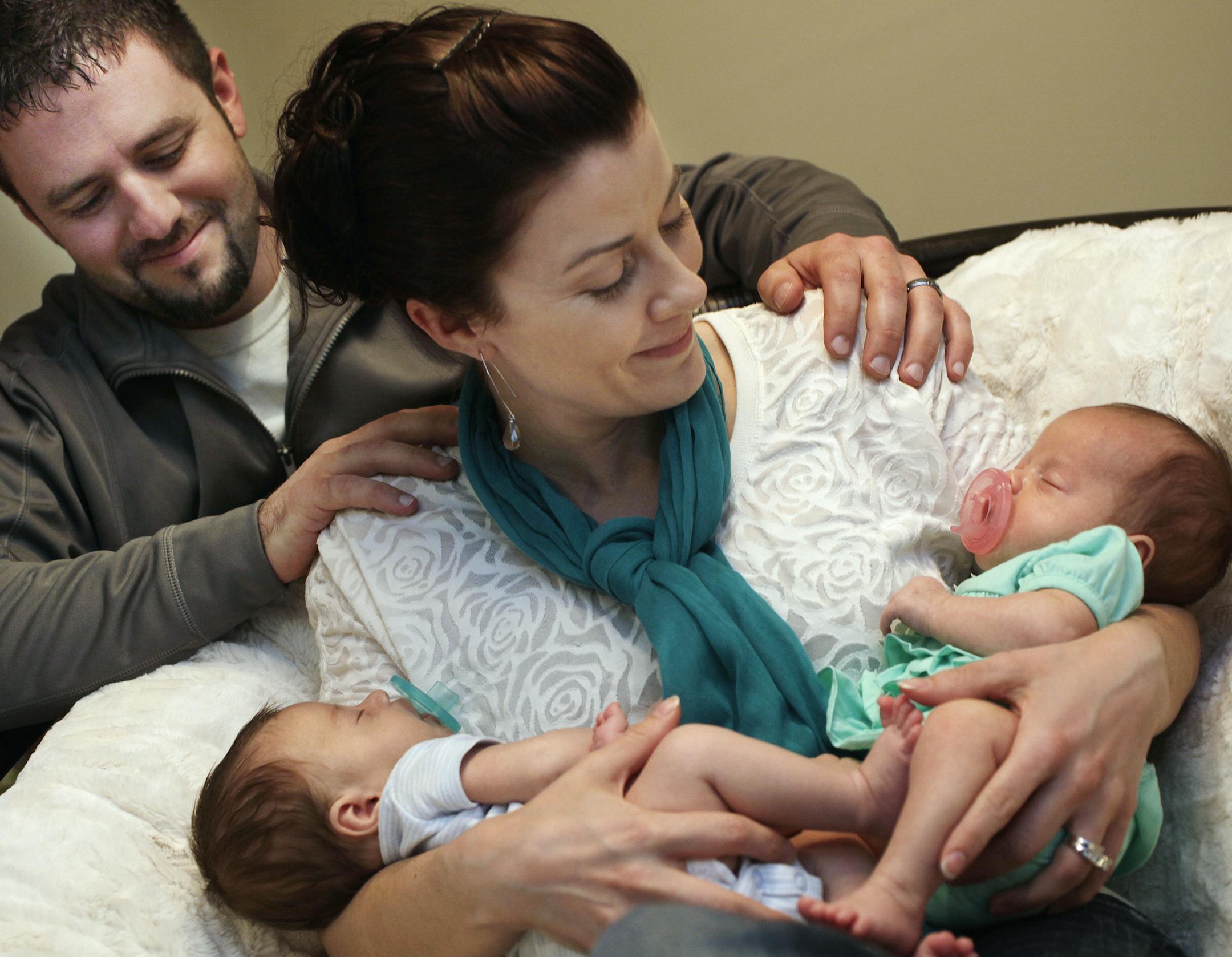 Kyle and Ali Drake with her twins Jace (left) and Joslynn, both seven weeks old in Prior Lake, MN on May 9, 2013. ] JOELKOYAMA‚Ä¢joel koyama@startribune.com Ali Drake was diagnosed with ovarian cancer and fought for her life. When she was cancer-free, she began the long road to motherhood, a difficult journey because she had an ovary removed during treatment. With IVF, she's now the mother of twins. Her treatment was funded, in part, through a MOCO Dream Award.