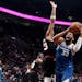 Karl-Anthony Towns drove to the basket as Trail Blazers forward Toumani Camara went for the block during first half Thursday.