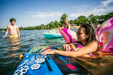 “The only good place I am going to be is in the water,” said University of Minnesota student Lexi Charpentie, who kept cool in her butterfly float