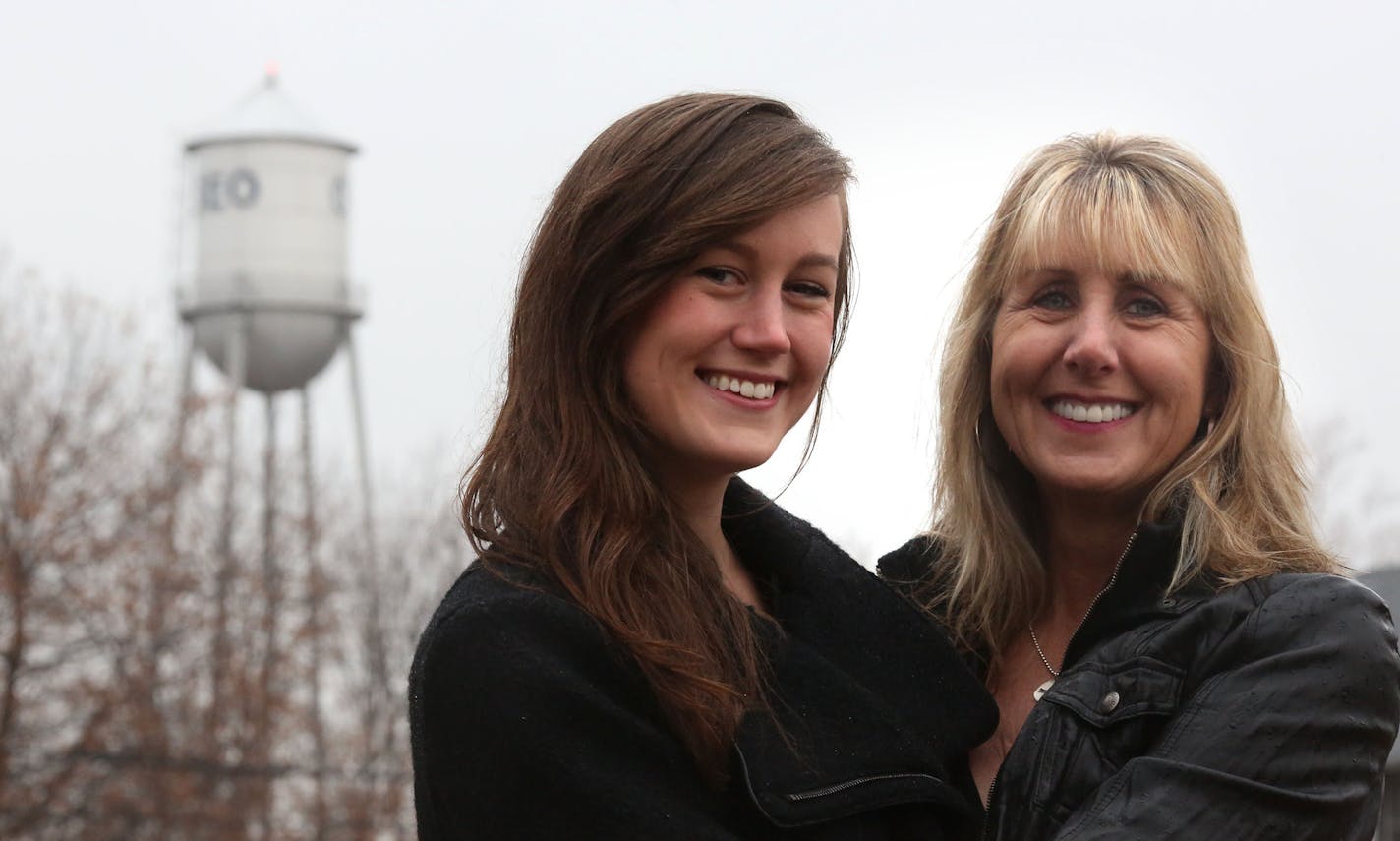 Kathleen Gette, right, and her daughter Lauren Bowe, 24, stood near the old water tower in Osseo. ] (KYNDELL HARKNESS/STAR TRIBUNE) kyndell.harkness@startribune.com In Osseo, Min., Wednesday, November 5, 2014. With the help of her daughter Lauren resident Kathleen Gette is leading the effort to save the iconic structure and add it to the list of 11 Minnesota water towers on the National Historic Registry.