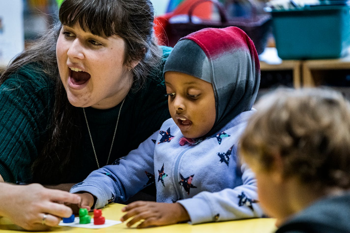 Minneapolis kindergarten teacher Courtney Cline helped students including Samira,6, with phonemic awareness