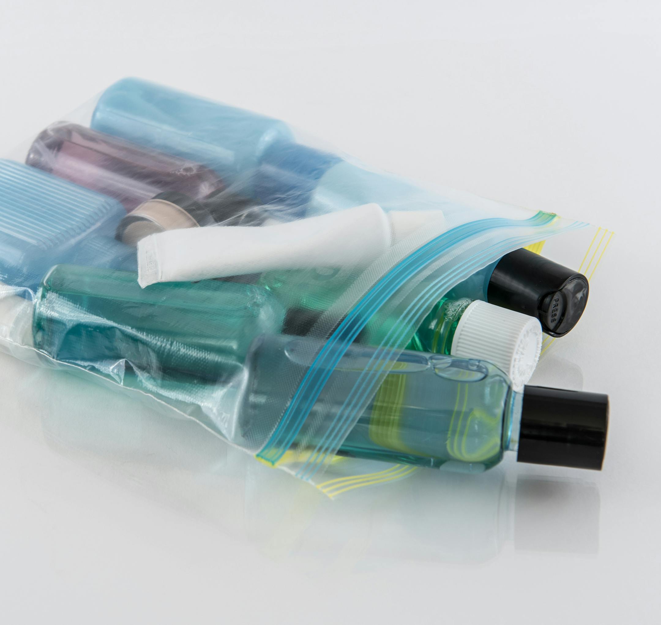 Travel-sized toiletries in quart-sized plastic bag. istock photo