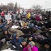 Black Lives Matter Minneapolis held an MLK march from Snelling and University in St. Paul to the Capitol on Monday. They "died in" on an I-94 overpass