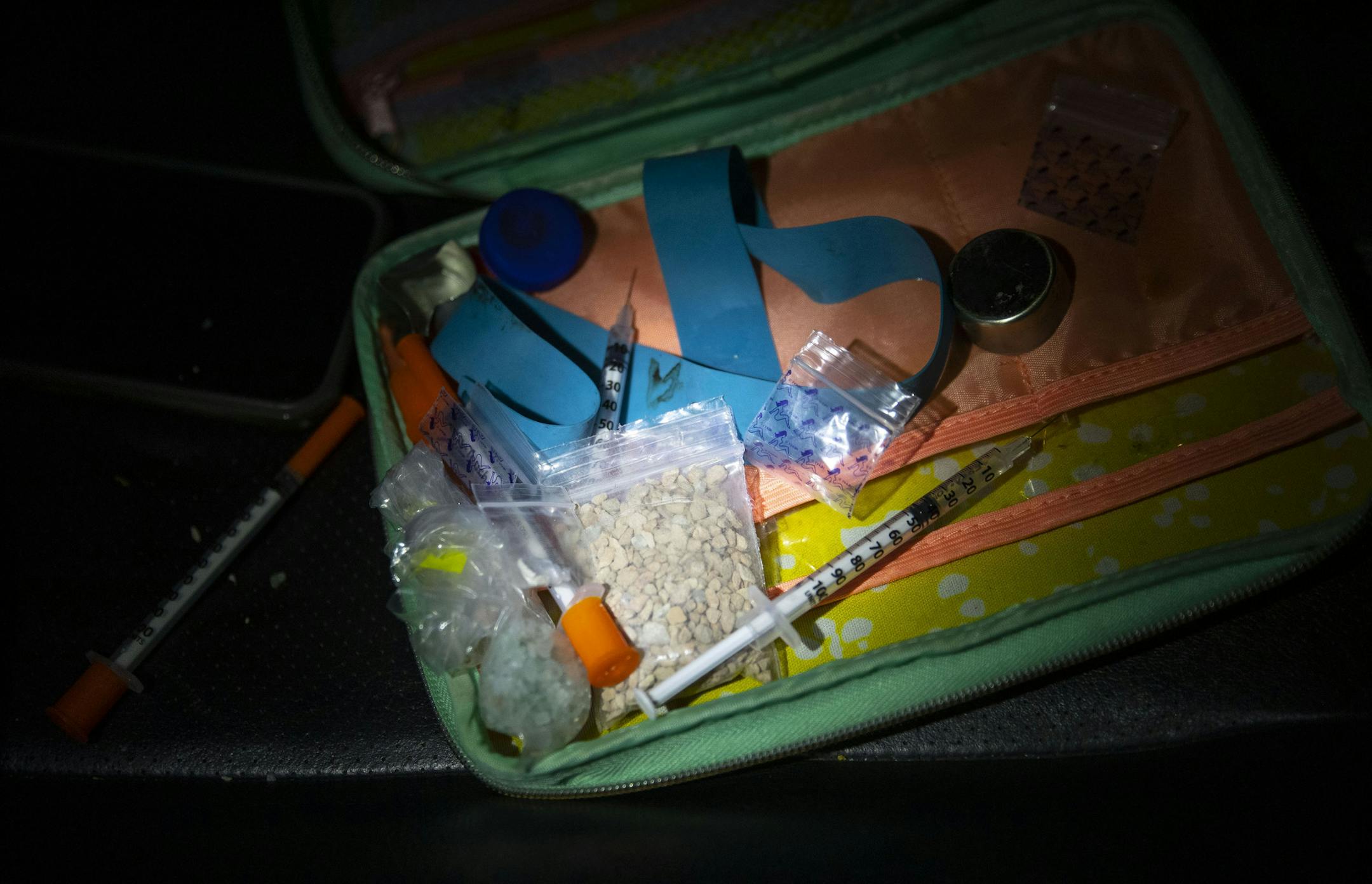 A few grams of heroine and collection of needles, some uncapped, were found by Deputy Ben Fye from the St. Louis County Sheriff's Office in a small bag in a car pulled over in a Walgreens parking lot in Duluth around 2am Thursday morning.] ALEX KORMANN • alex.kormann@startribune.com In recent years there has been a large increase in meth, heroine and opioids flowing into Duluth, MN in recent years. The Duluth Police Department and St. Louis Sheriff's Department has worked in tandem with t