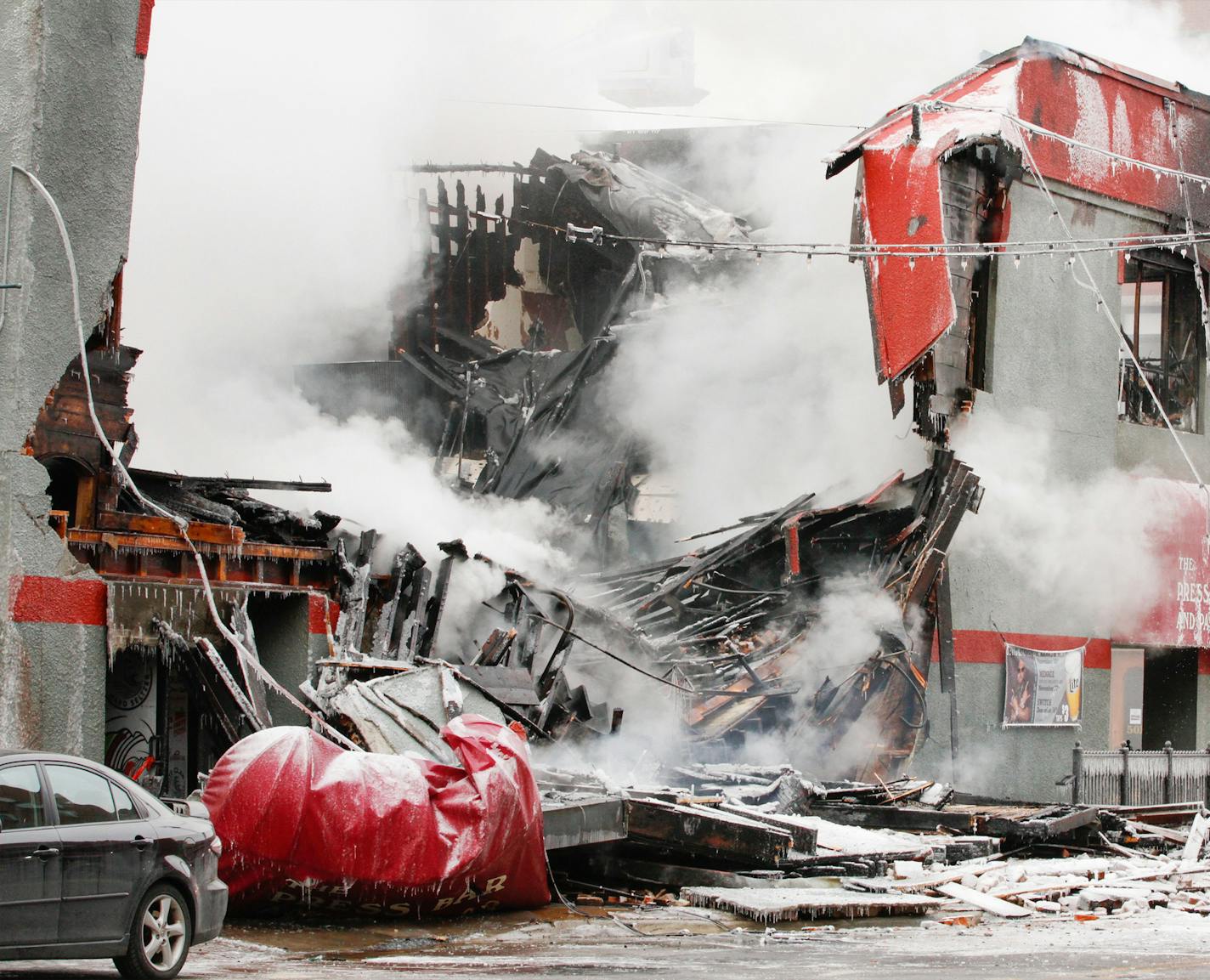 Firefighters from St. Cloud, Sartell and Sauk Rapids battle a major fire in downtown St. Cloud at the Press Bar and Parlor Monday, Feb. 17, 2020, at 502 W. St. Germain Street in St. Cloud, Minn. JASON WACHTER - SPECIAL TO THE STAR TRIBUNE