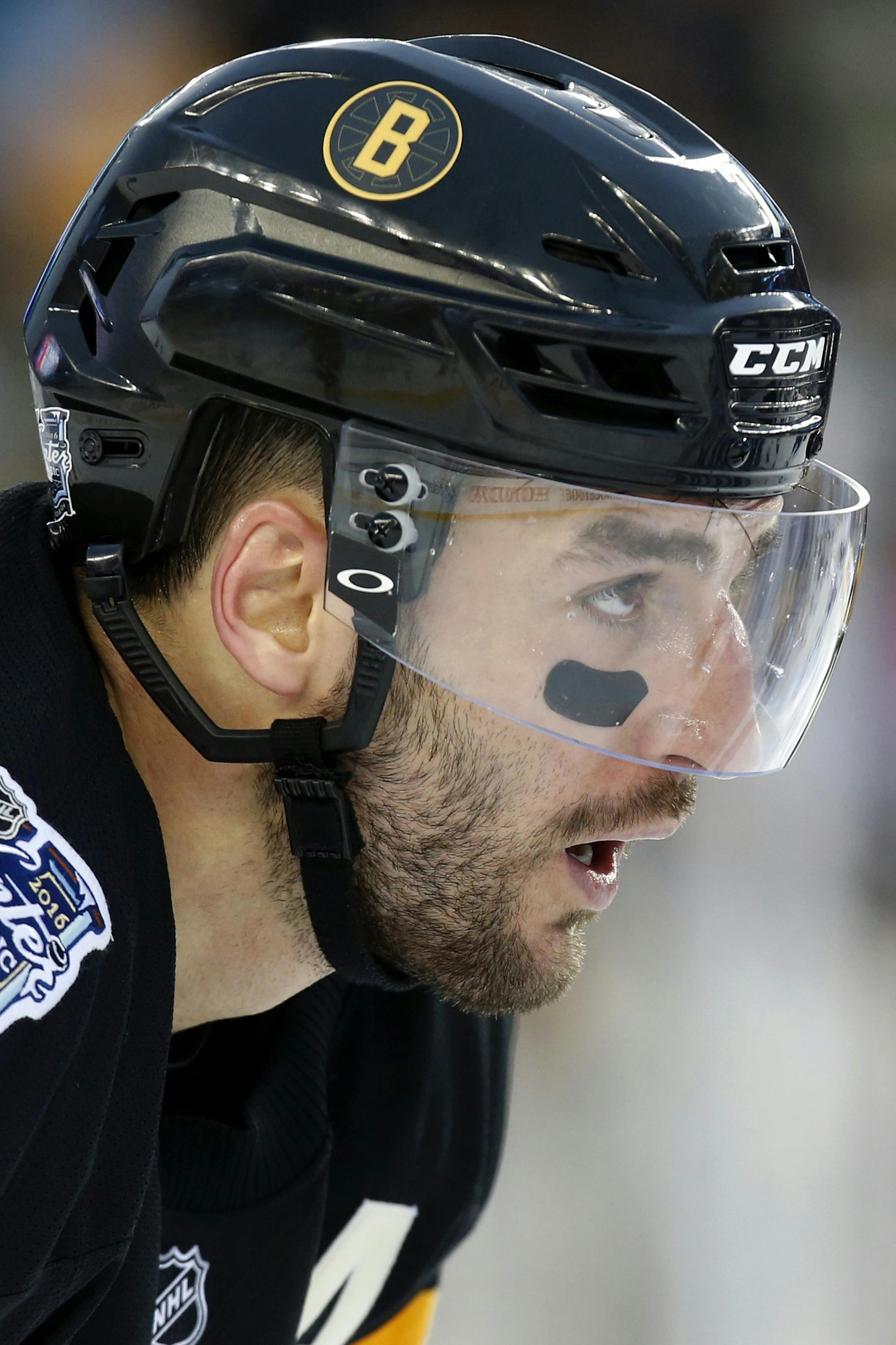 Boston Bruins' Patrice Bergeron during the second period of the NHL Winter Classic hockey game against the Montreal Canadiens at Gillette Stadium in Foxborough, Mass., Friday, Jan. 1, 2016. The Canadiens won 5-1. (AP Photo/Michael Dwyer)
