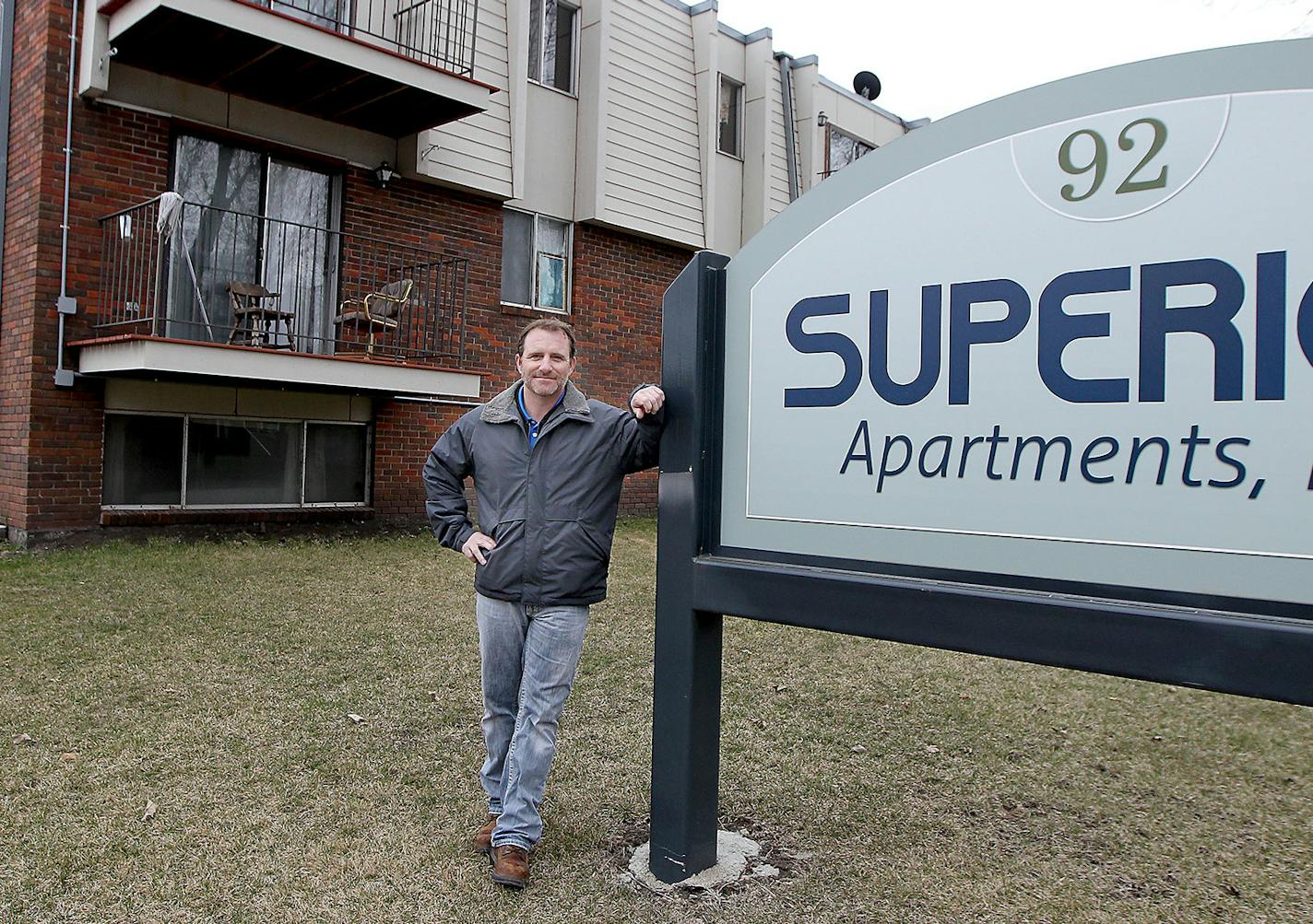 Dan Sparr, human resource director for Hancock Concrete in Hancock, Minn. stood outside an apartment building the company bought to house temporary workers.