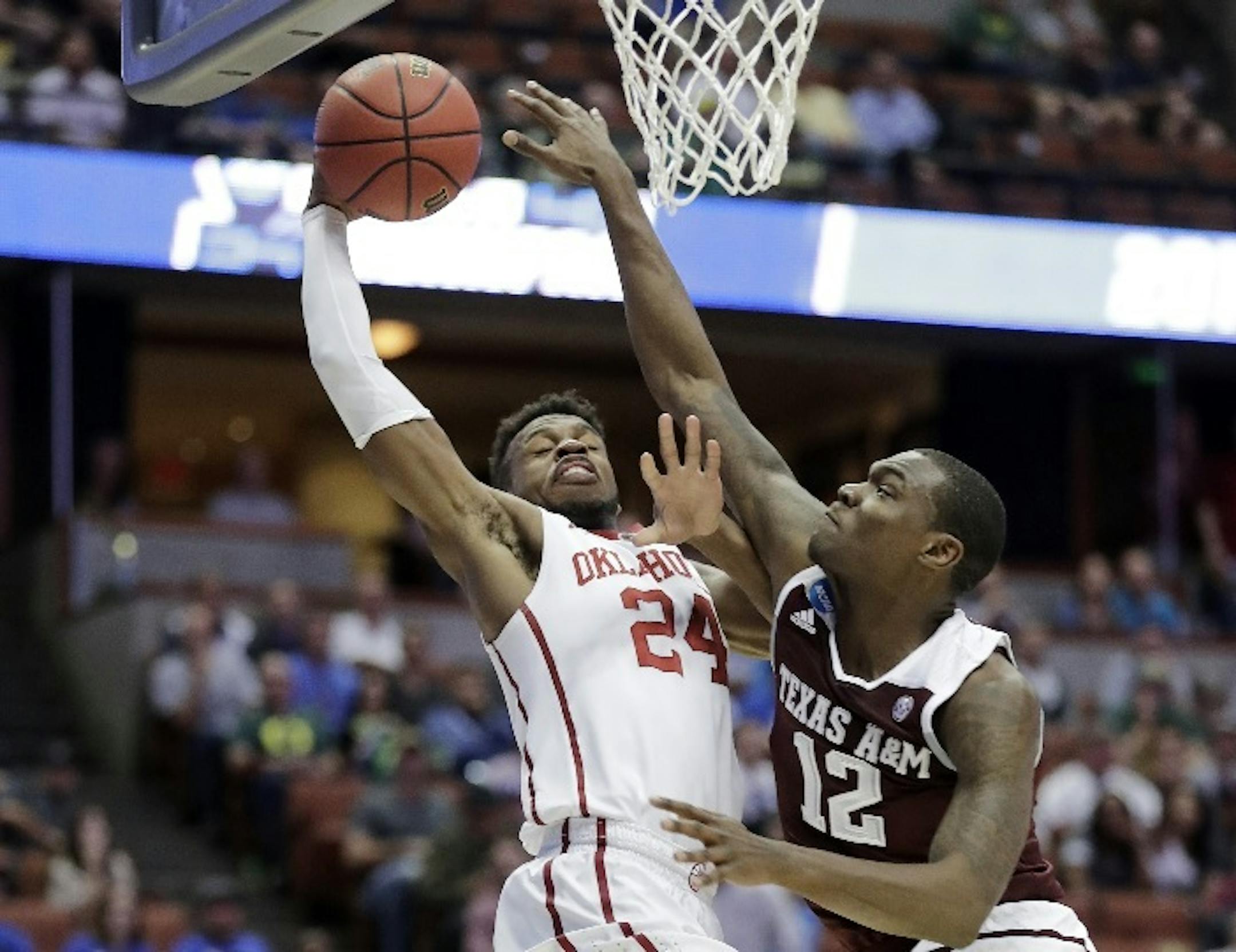 Oklahoma guard Buddy Hield shot over Texas A&M guard Jalen Jones during the first half of an NCAA regional semifinal game. Hield could be an attractive option for the Timberwolves at No. 5 next month in the NBA draft.