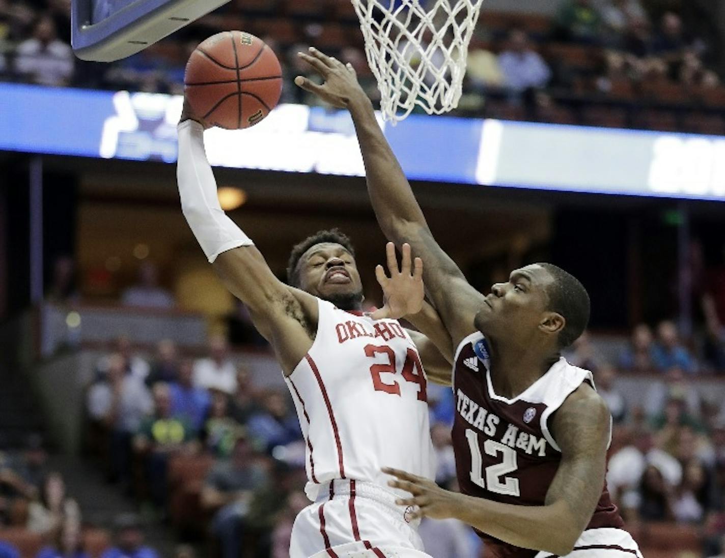 Oklahoma guard Buddy Hield shot over Texas A&M guard Jalen Jones during the first half of an NCAA regional semifinal game. Hield could be an attractive option for the Timberwolves at No. 5 next month in the NBA draft.