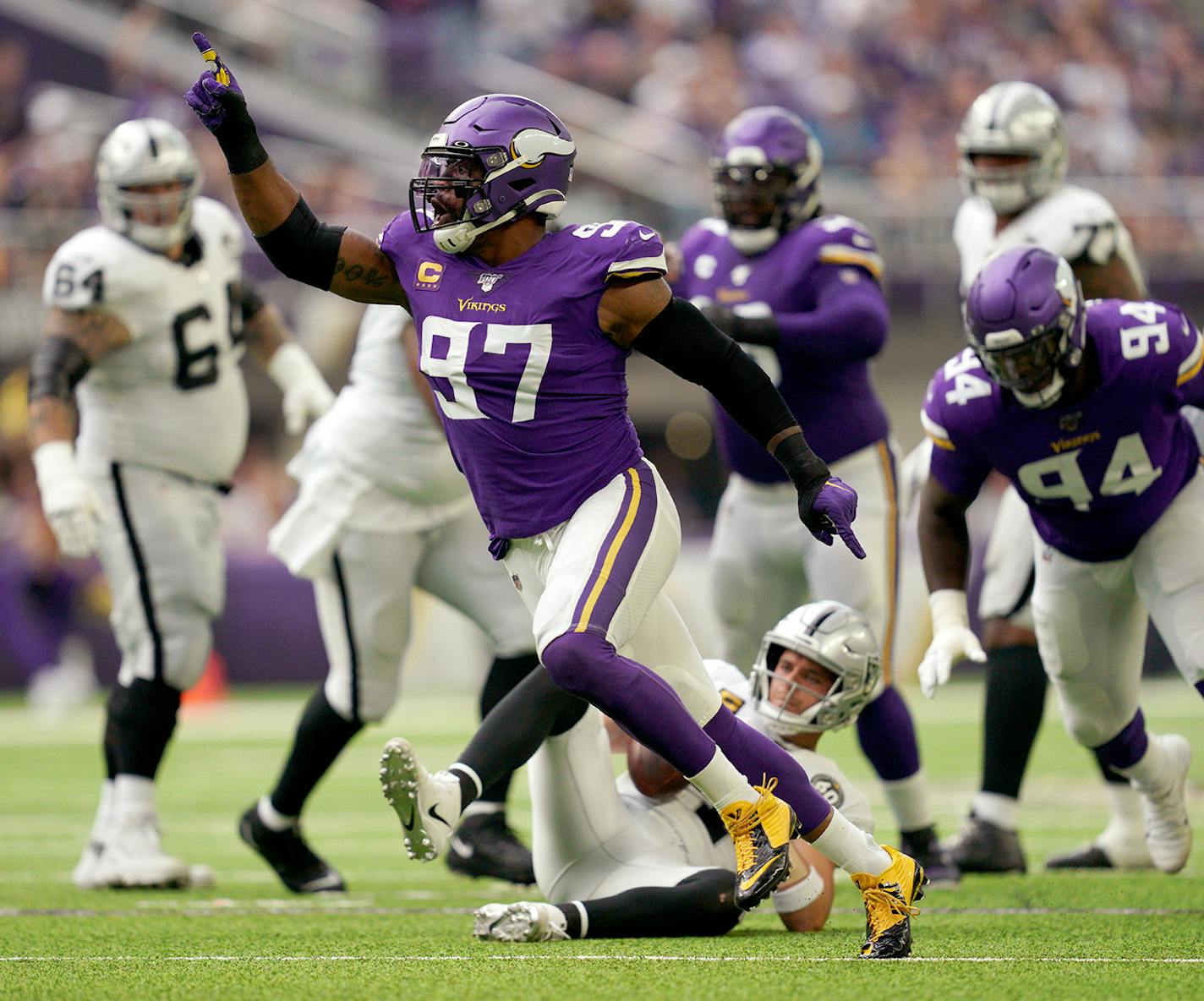 Everson Griffen (97) celebrated after he sacked Oakland Raiders quarterback Derek Carr (4) in the second quarter.