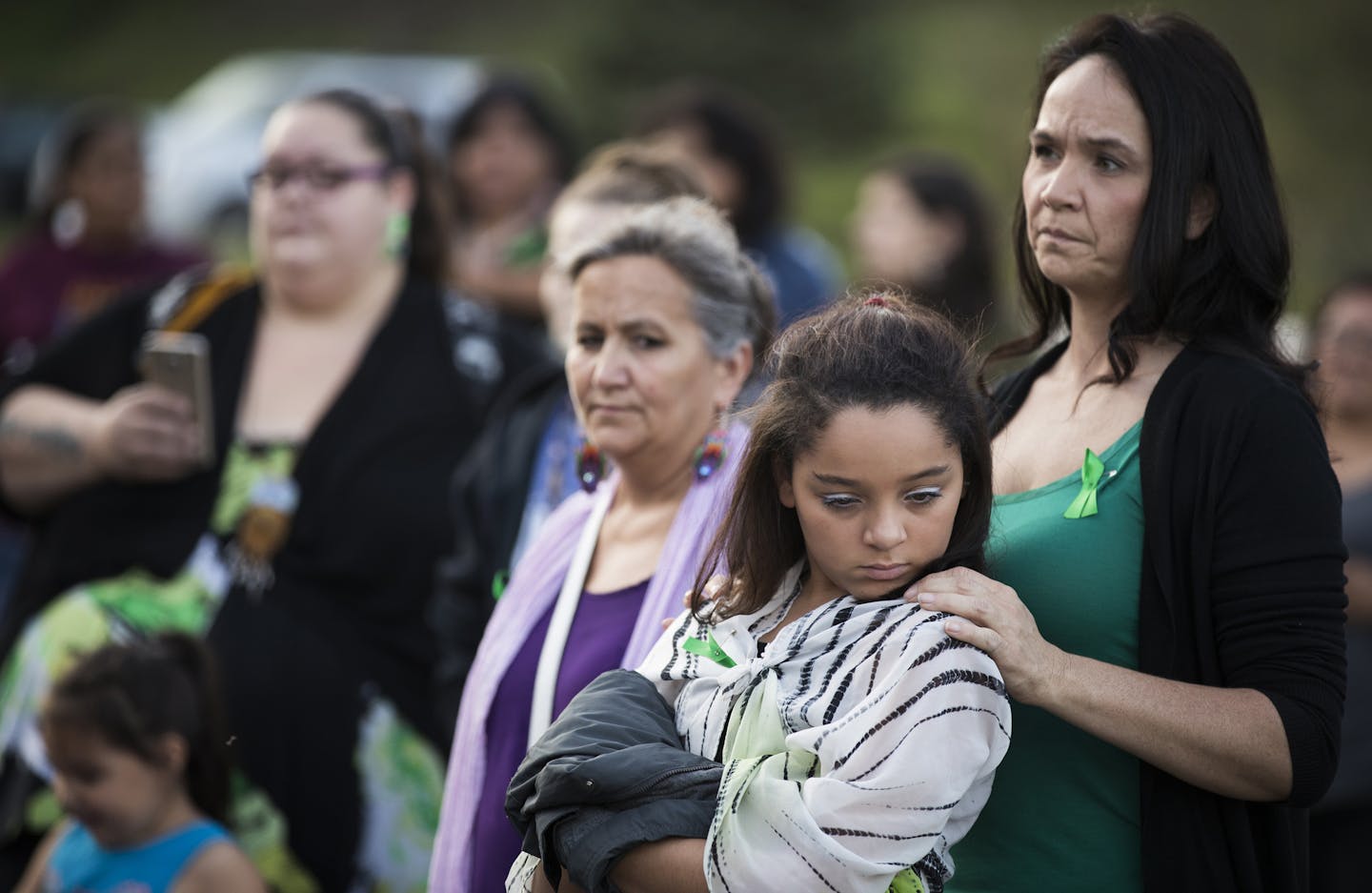 Nicole Matthews, right, of Minneapolis and her daughter Kiora Burgess-Matthews, 13, attend a prayer circle Tuesday for Savanna LaFontaine-Greywind.