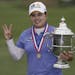 Inbee Park of South Korea held the championship trophy after winning the U.S. Women's Open golf tournament at Sebonack Golf Club on Sunday in Southamp