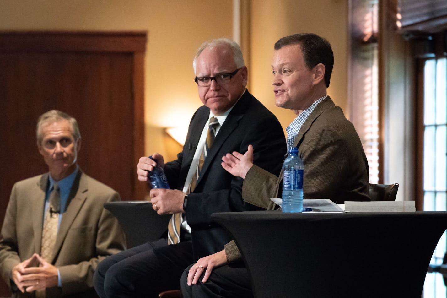 Republican Jeff Johnson, right, and DFLer Tim Walz, center, debated at Grand View Lodge in Nisswa, Minn., Friday. KSTP's Tom Hauser, left, was the moderator.