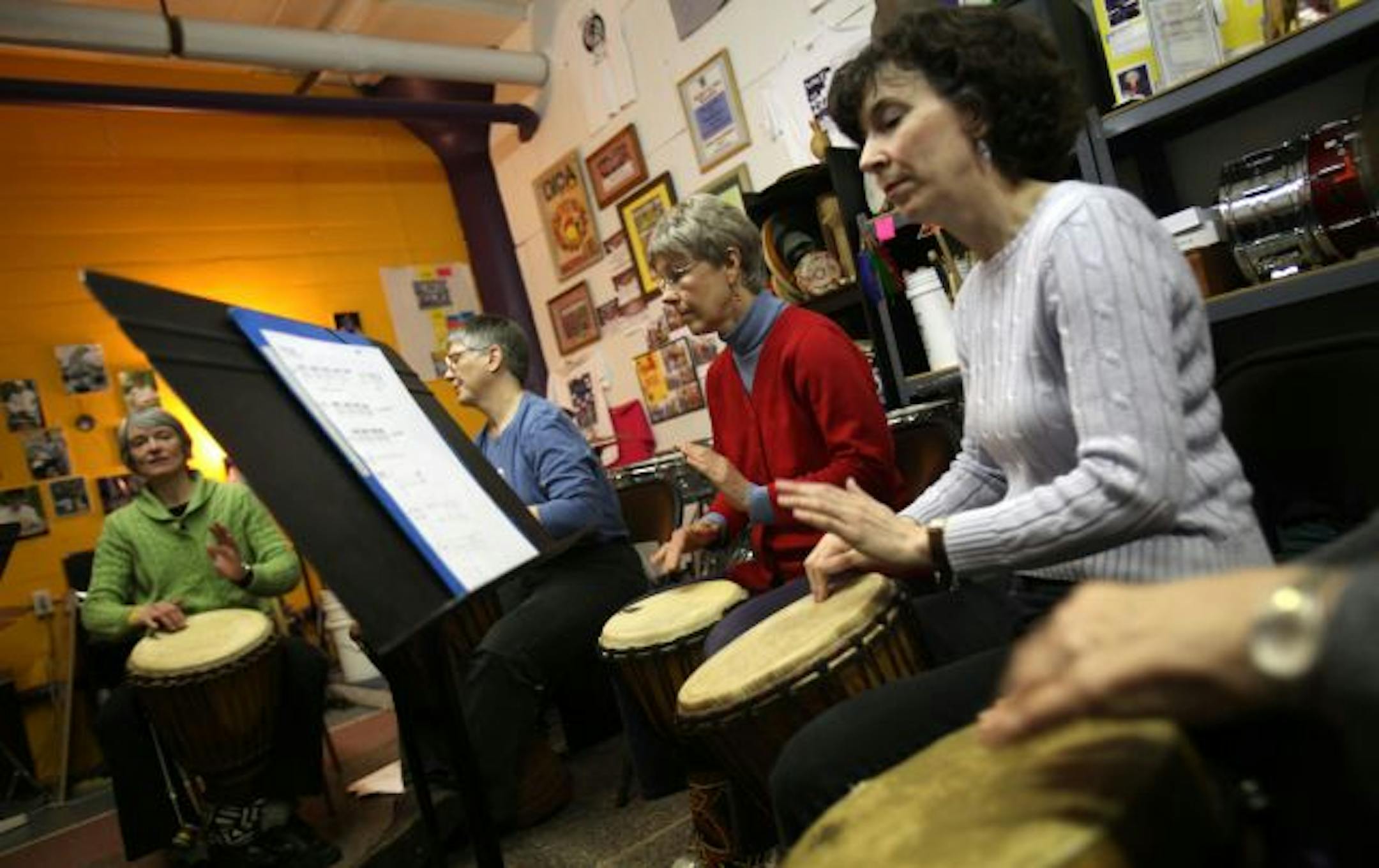 Leader of the class Marisa Cuneo-Linsly, left, played with other Women's Drum Center members from left Jill Beyer, of Minneapolis, Pam Newsome, and Kathy Donohue, of St. Paul.