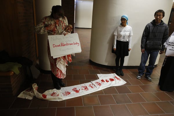 Protesters outside lecture hall at the University of Minnesota law school Tuesday. (photo courtesy of U of M)