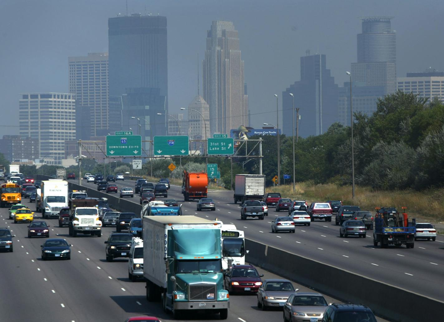 The Minneapolis skyline behind commuters on I-35W is hazy Friday as pollution levels reach the precautionary levels. The pollution is primarily fine particles, some of which have local sources and some of which are blowing into Minnesota from the south. Ozone, the main component of smog, may also rise as the day's heat increases.